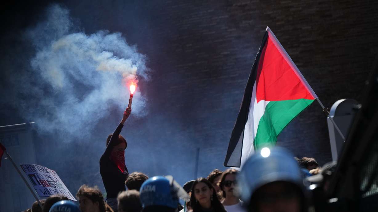 Pro-Palestinian demonstrators gather for a national general strike called by different unions to protest against the situation in Gaza two days after Israeli forces intercepted a Gaza-bound aid flotilla in the Mediterranean Sea, in Rome, Friday, Oct. 3, 2025.