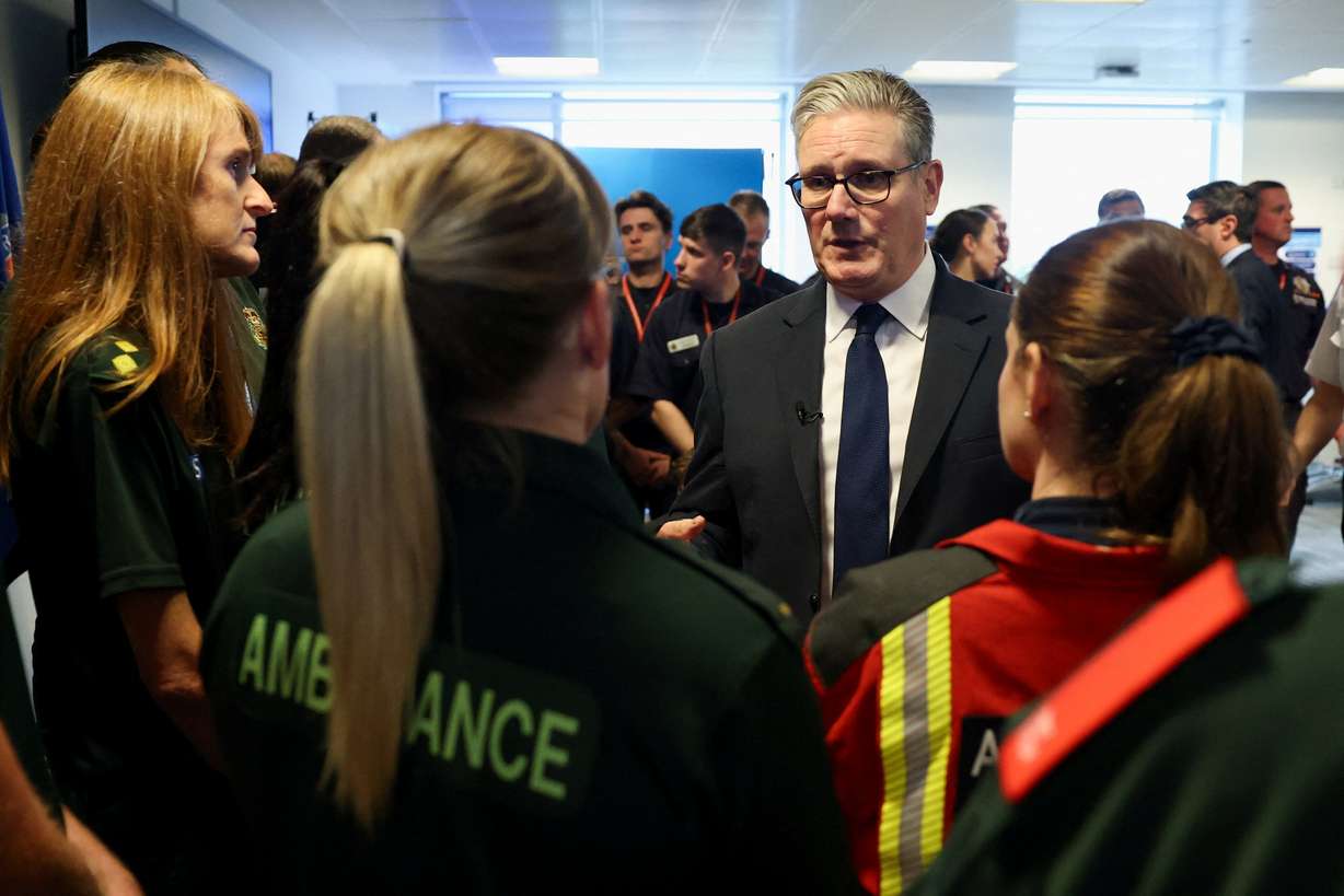 Britain's Prime Minister Keir Starmer meets emergency services workers at the Greater Manchester Police headquarters in Manchester, England, Friday, after multiple people were killed Thursday on Yom Kippur in what police have declared a terrorist incident.