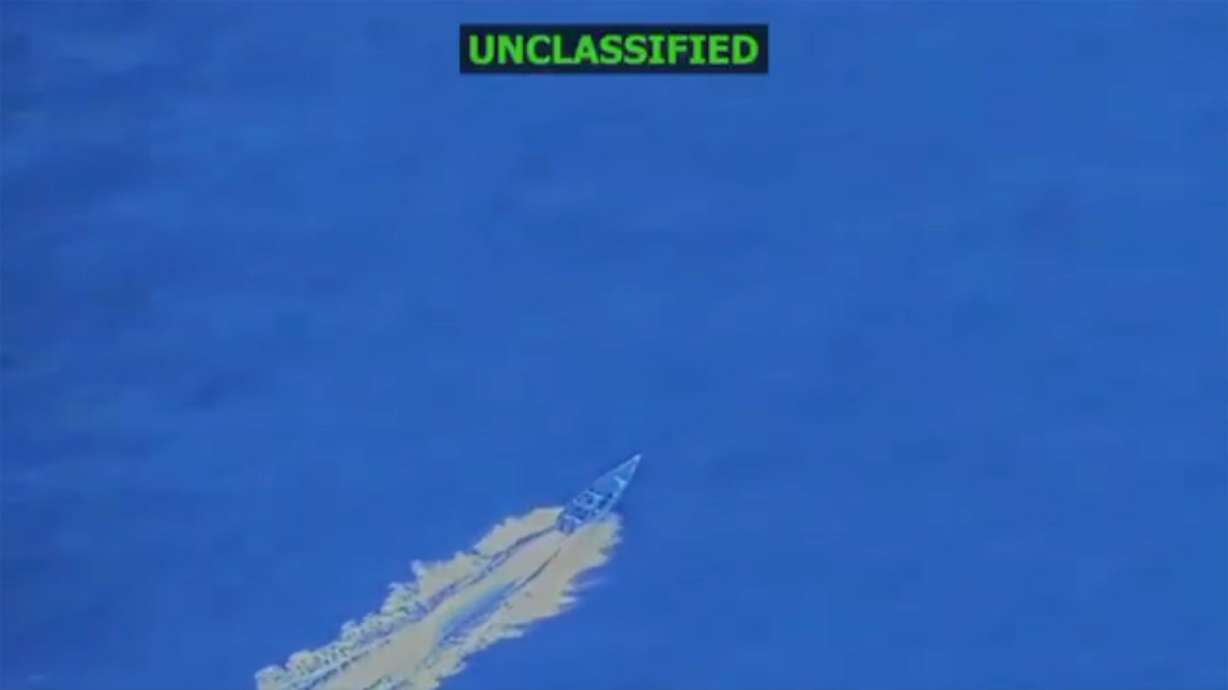 In this screengrab taken from a video posted by Defense Secretary Pete Hegseth on Friday, a boat is visible just before it is hit by a military strike, off the coast of Venezuela. In his post, Hegseth said the boat was trafficking narcotics and that four men onboard were killed.
