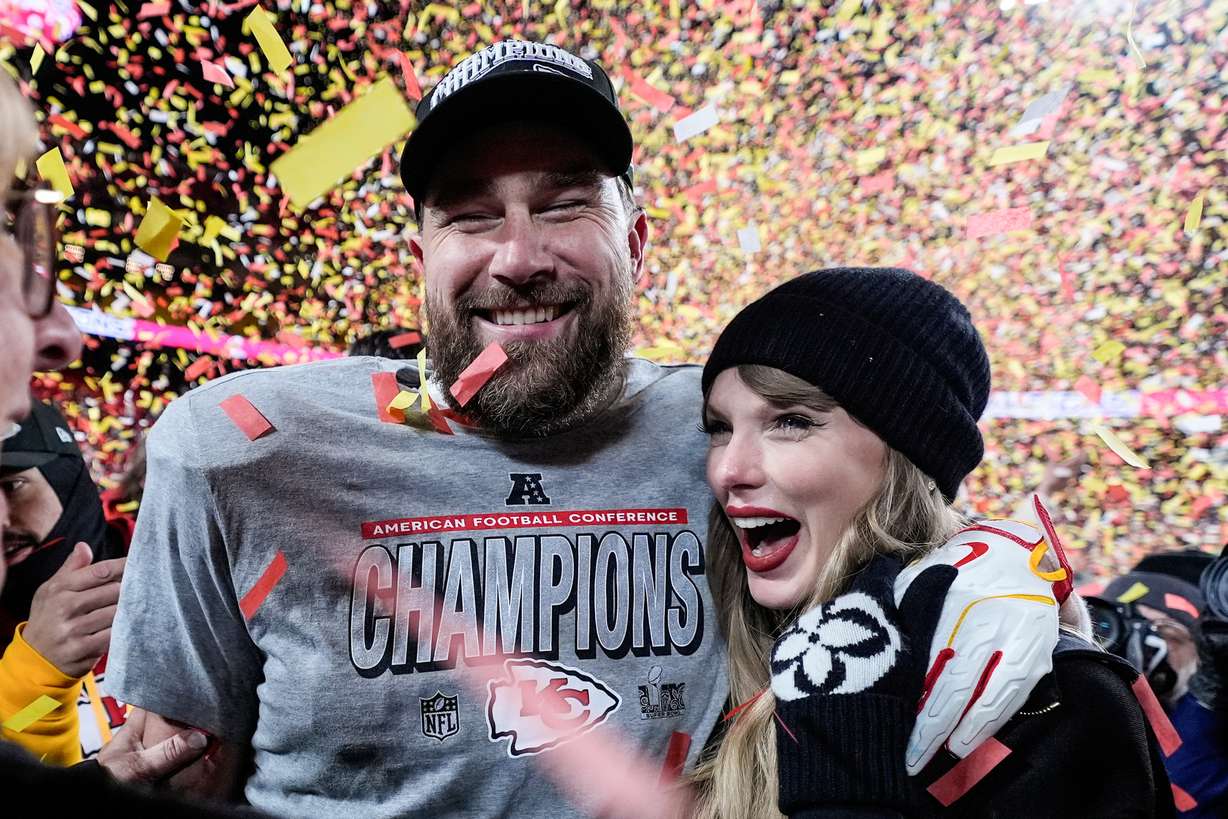 Travis Kelce and Taylor Swift after the AFC Championship game, Jan. 26, in Kansas City, Mo. Kelce, Swift's fiance, makes a brief appearance in the docuseries "The End of an Era," released on Disney+ on Friday.