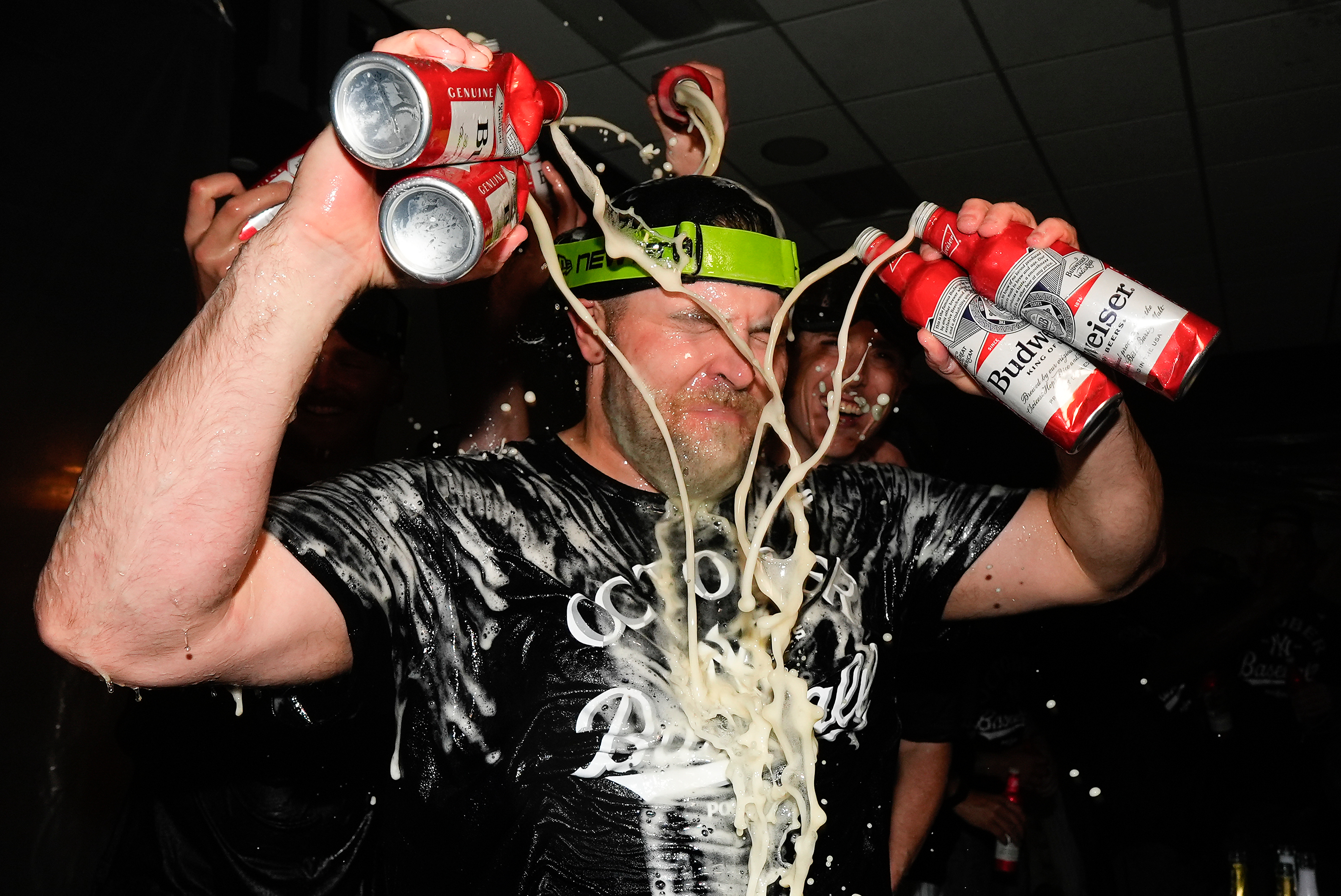 New York Yankees pitcher David Bednar (53) sprays himself with beer while celebrating with teammates after the Yankees defeated the Boston Red Sox in Game 3 of an American League wild-card baseball playoff series, Thursday, Oct. 2, 2025, in New York. 