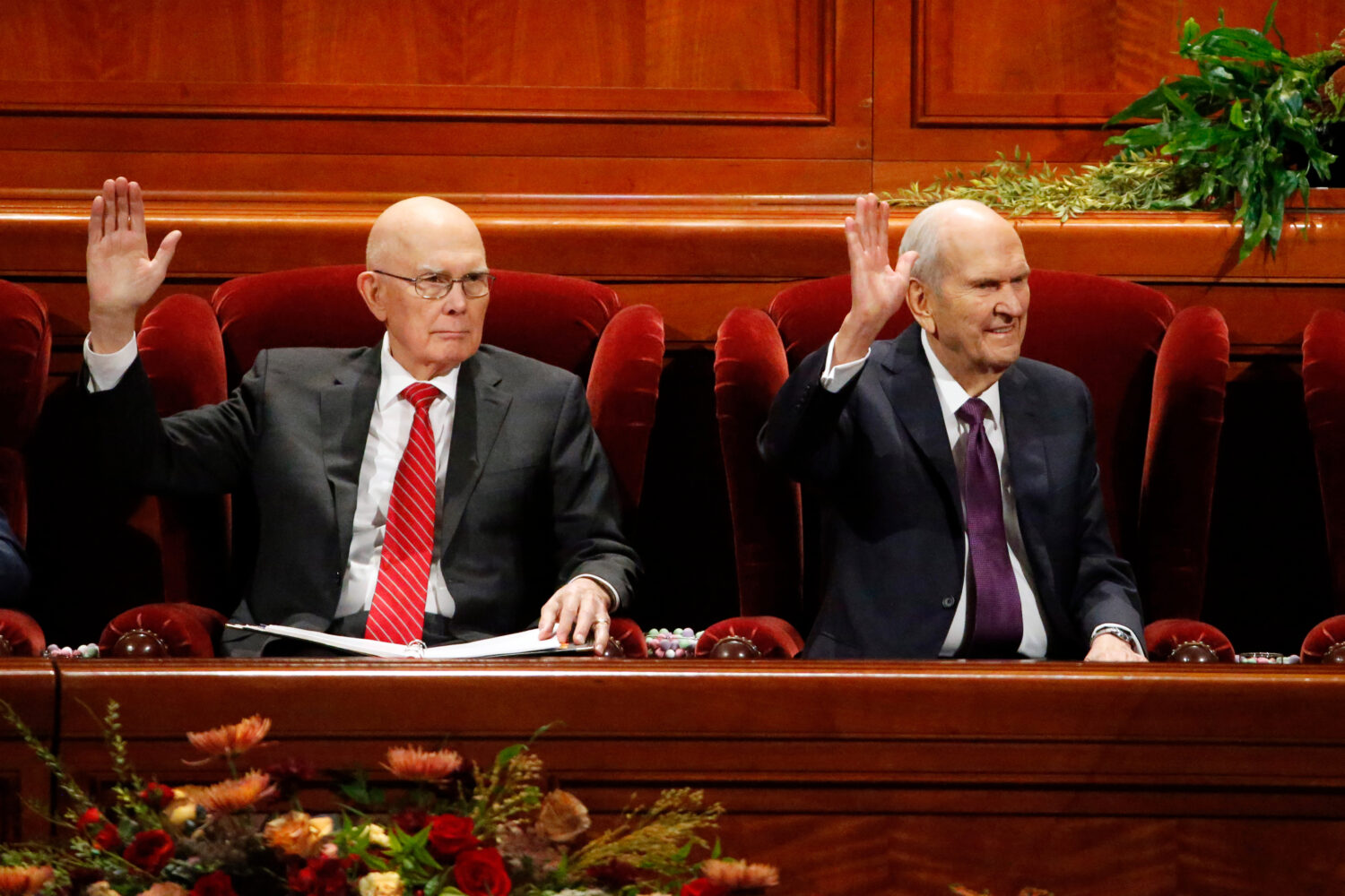President Dallin H. Oaks and President Russell M. Nelson raise their hands during the sustaining of church authorities in October 2019. Oaks is expected to speak at general conference this weekend and succeed President Nelson, who died on Sept. 27.