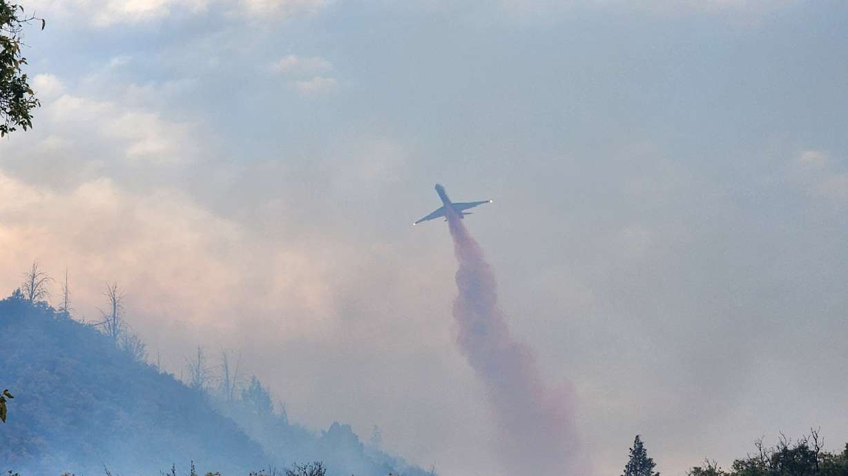 Fire crews drop retardant on the Cherry Fire on Friday as it burns over 650 acres in Utah County