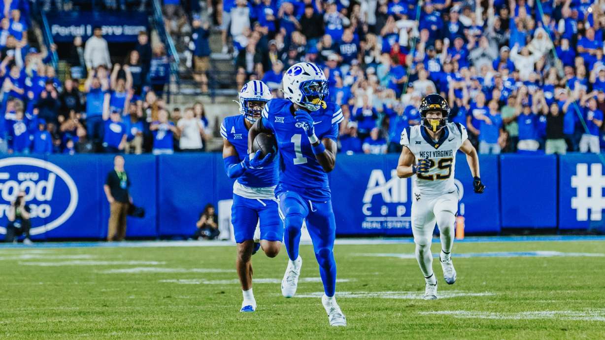 BYU's Therrian "Tre" Alexander III returns an interception during the first half of the Cougars' Big 12 football game against West Virginia, Friday, Oct. 3, 2025 at LaVell Edwards Stadium in Provo, Utah.