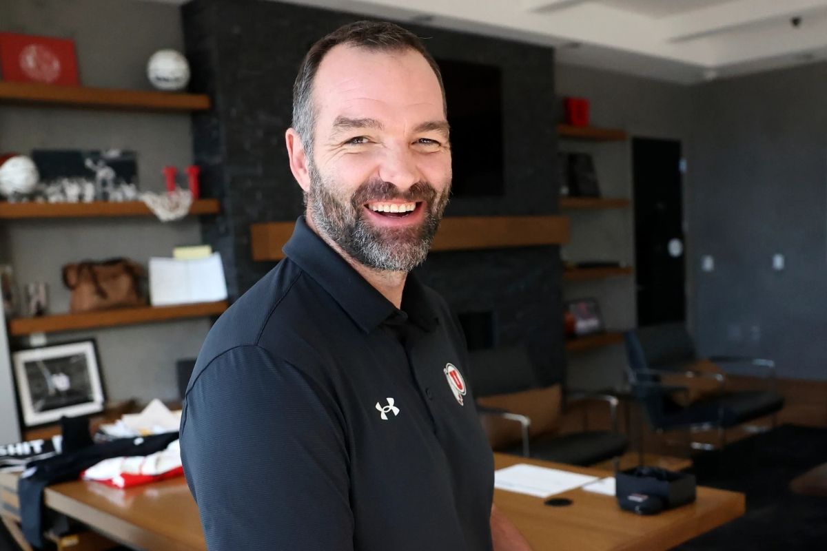 University of Utah men’s basketball head coach Alex Jensen poses for a portrait in his office in the Jon M. and Karen Huntsman Basketball Facility in Salt Lake City on Wednesday.