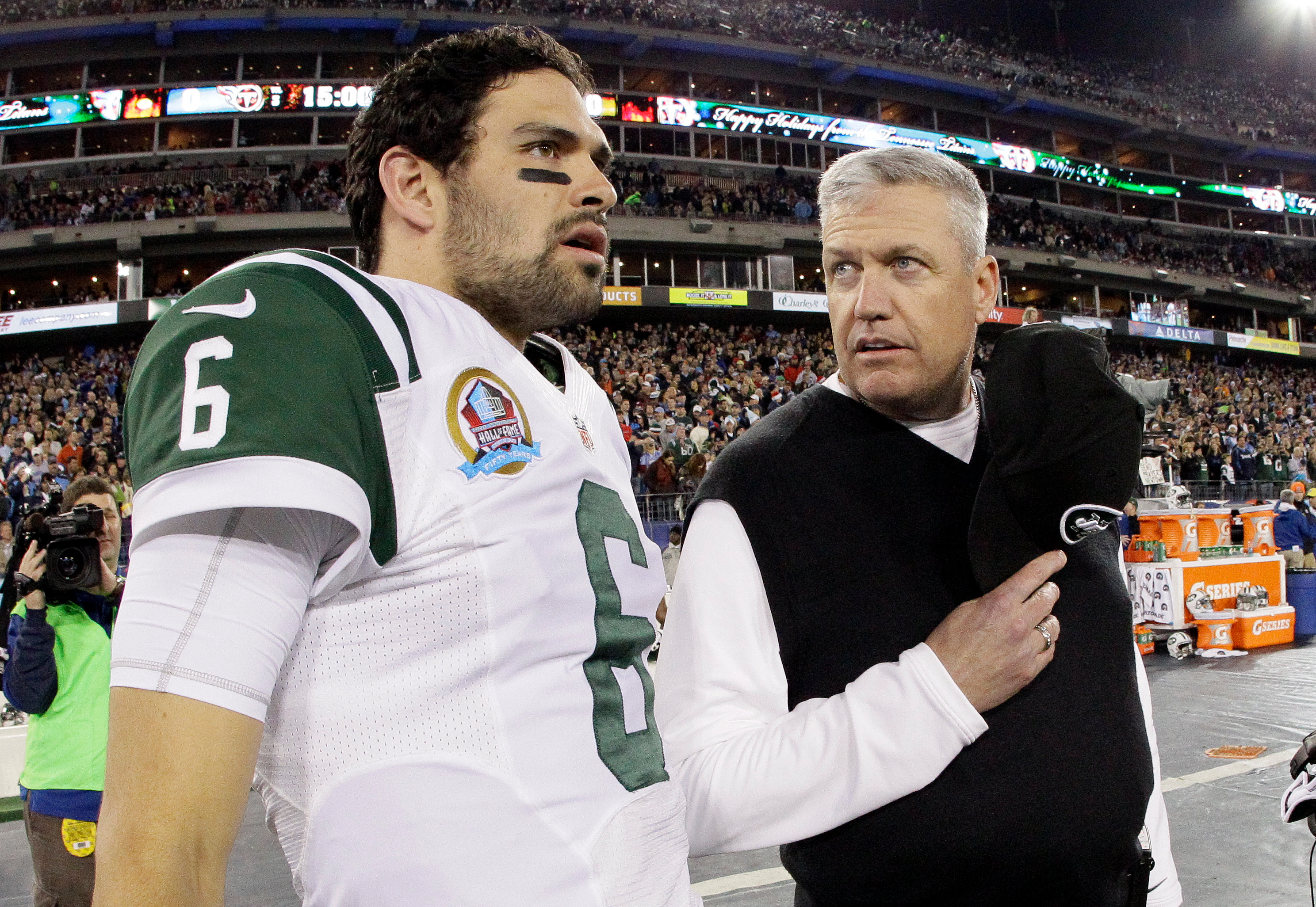 FILE - New York Jets head coach Rex Ryan, right, talks with quarterback Mark Sanchez (6) before an NFL football game between the Tennessee Titans and the New York Jets on Monday, Dec. 17, 2012, in Nashville, Tenn.