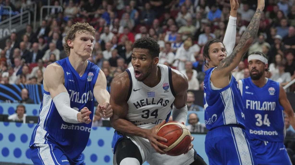 Finland's Lauri Markkanen, left, and Greece's Giannis Antetokounmpo in action during the Eurobasket, European Basketball Championship third place match between Greece and Finland at the Riga Arena in Riga, Latvia, Sunday, Sept. 14, 2025.