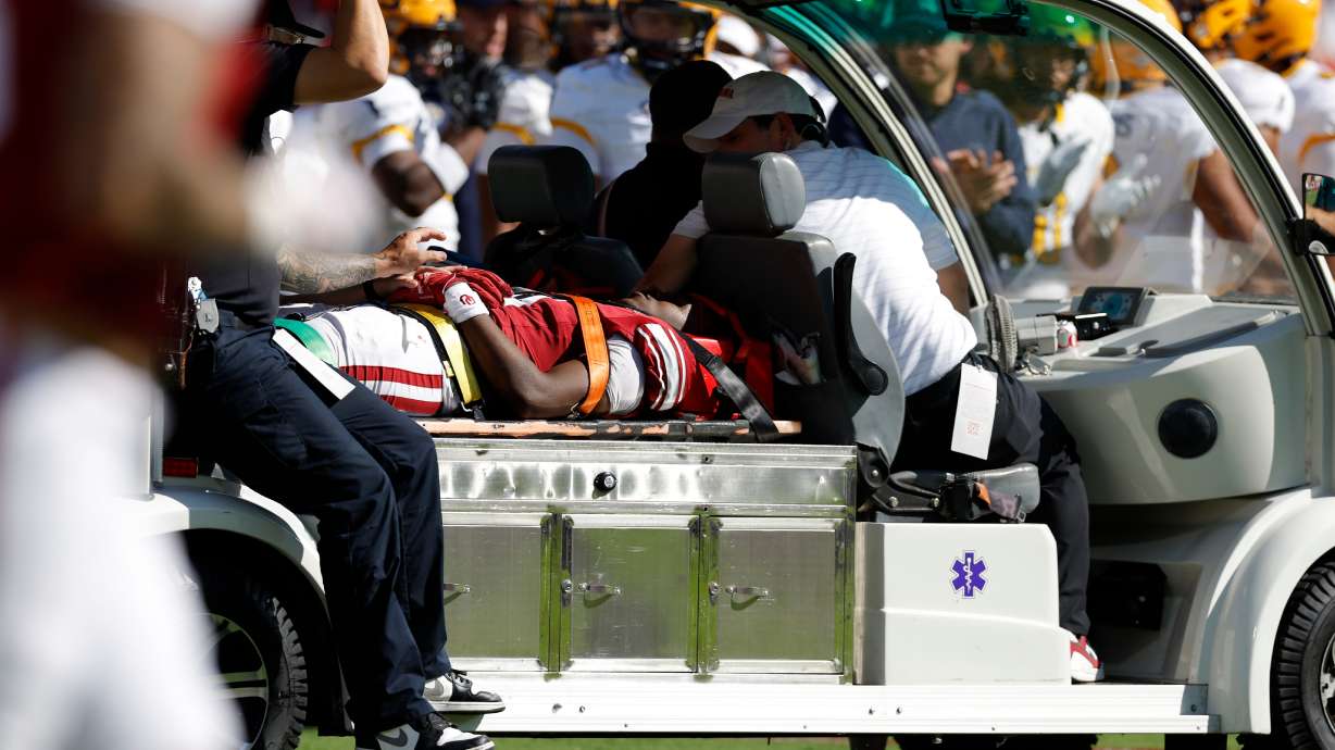 Oklahoma wide receiver Keontez Lewis, center, is carted off the field after a play against Kent State during the first half of an NCAA college football game Saturday, Oct. 4, 2025, in Norman, Okla.