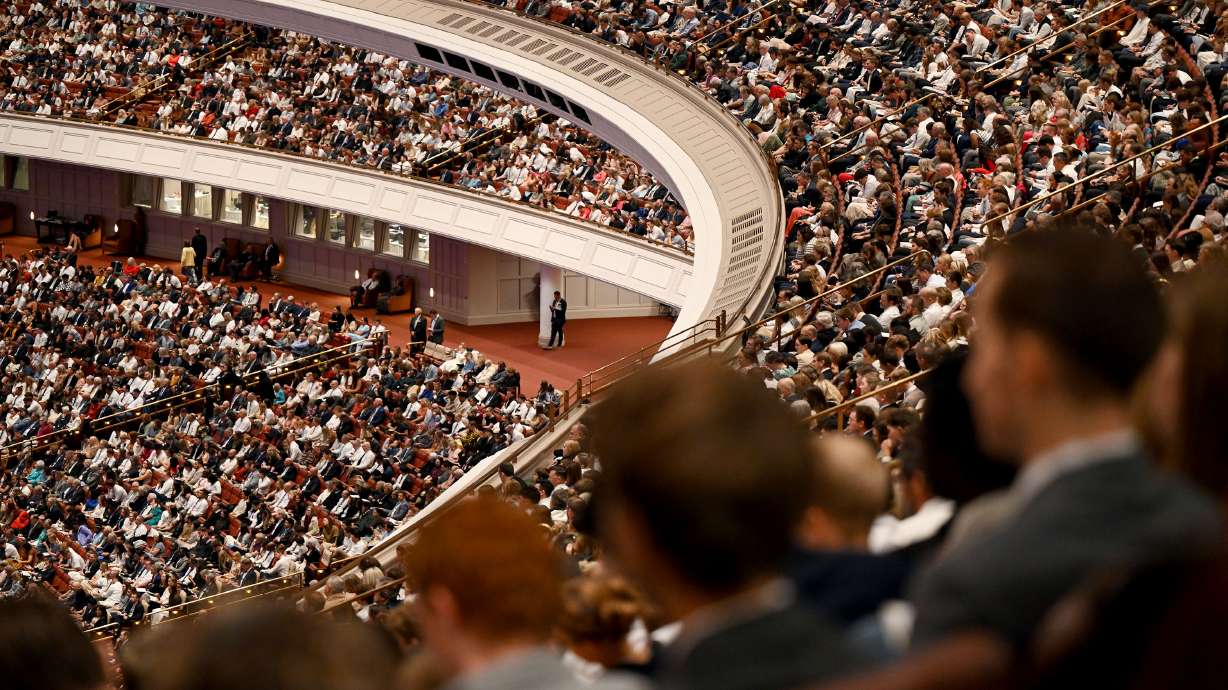 Attendees listen during the Saturday morning session of general conference of The Church of Jesus Christ of Latter-day Saints in the Conference Center in Salt Lake City.