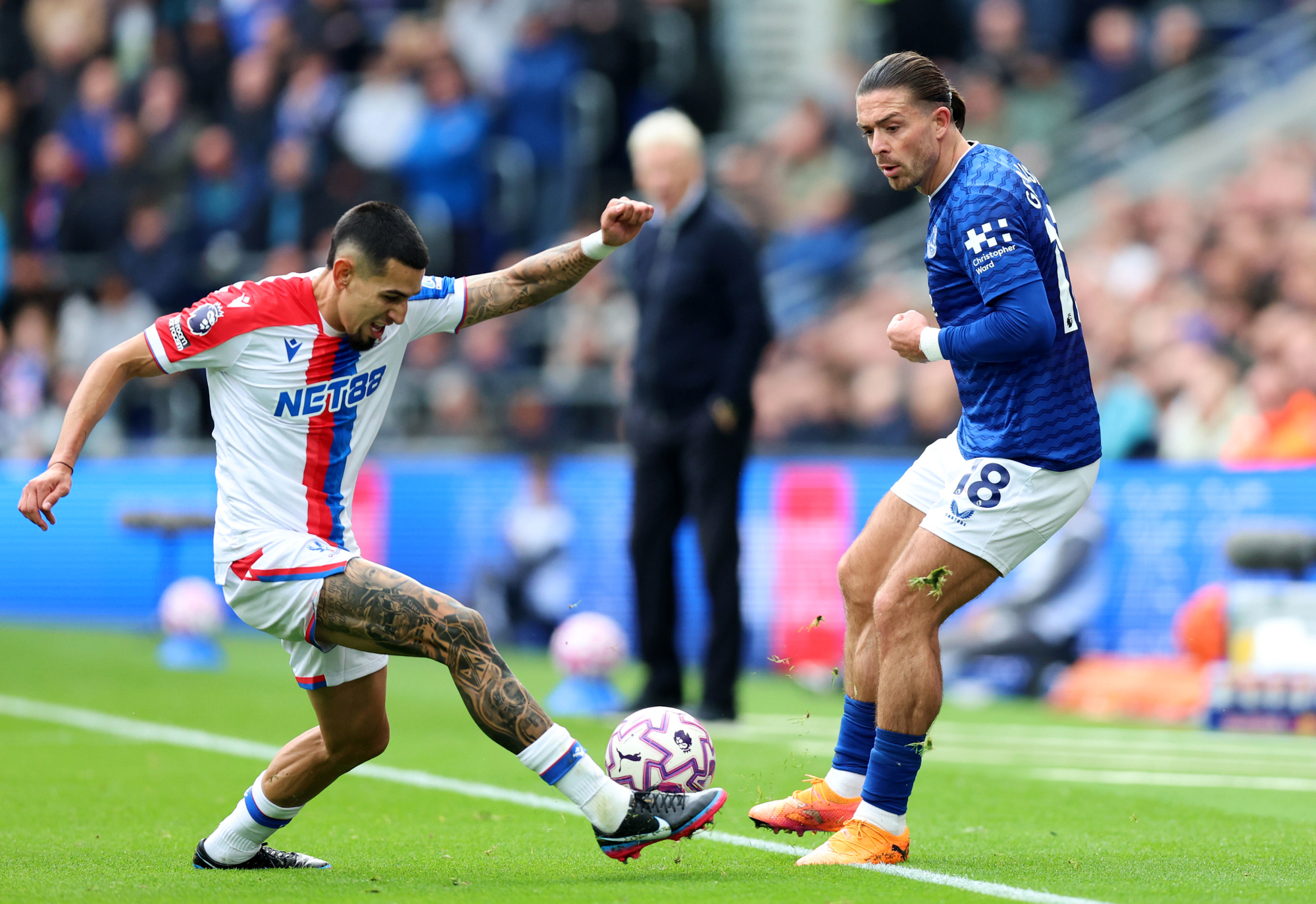Crystal Palace's Daniel Munoz, left, and Everton's Jack Grealish battle for the ball during the English Premier League soccer match at the Hill Dickinson Stadium, Liverpool, England, Sunday, Oct. 5, 2025. 