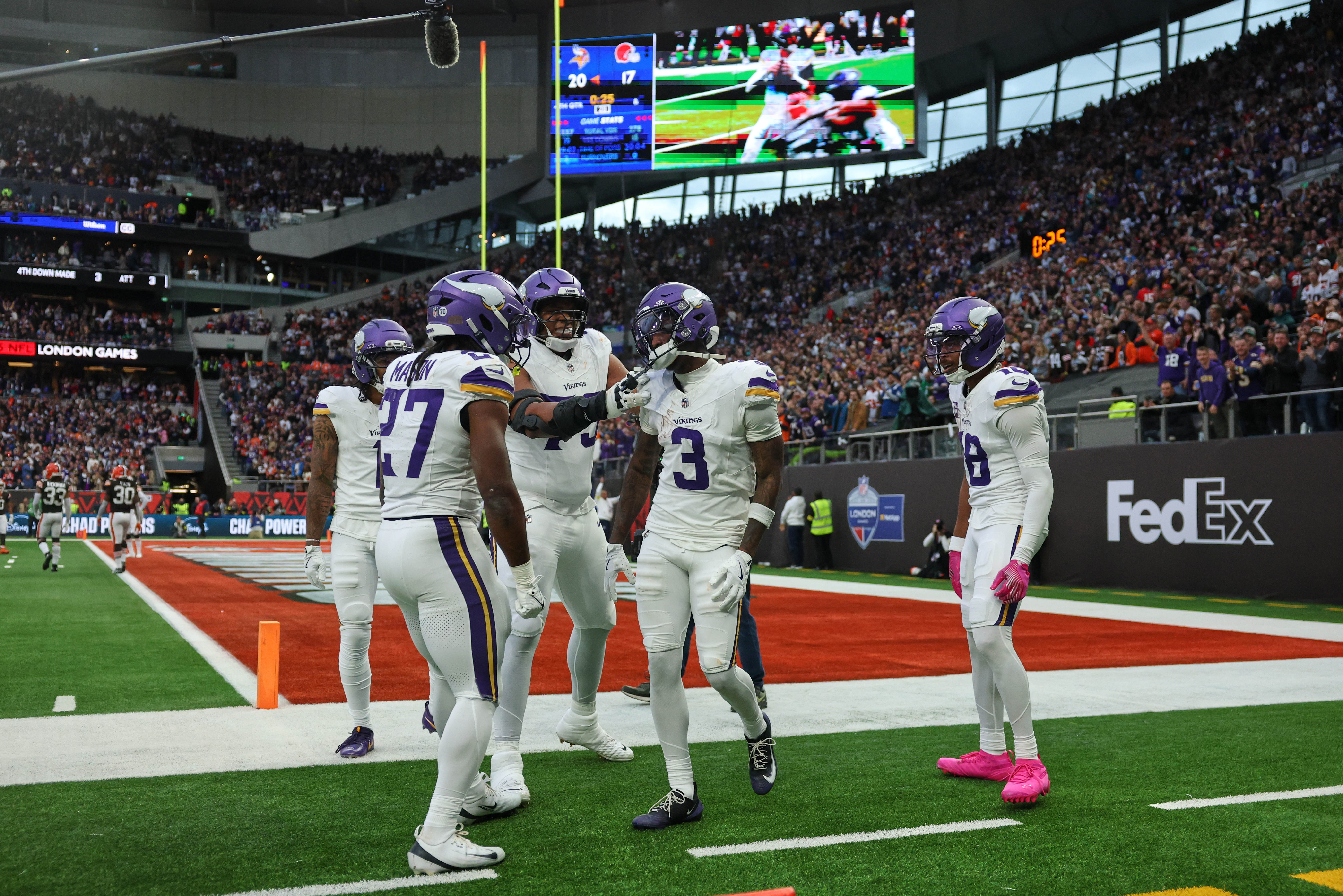 Minnesota Vikings wide receiver Jordan Addison (3) celebrates with his teammates after scoring a touchdown during the second half of the NFL game between Minnesota Vikings and Cleveland Browns at the Tottenham Hotspur stadium in London, Sunday, Oct. 5, 2025.