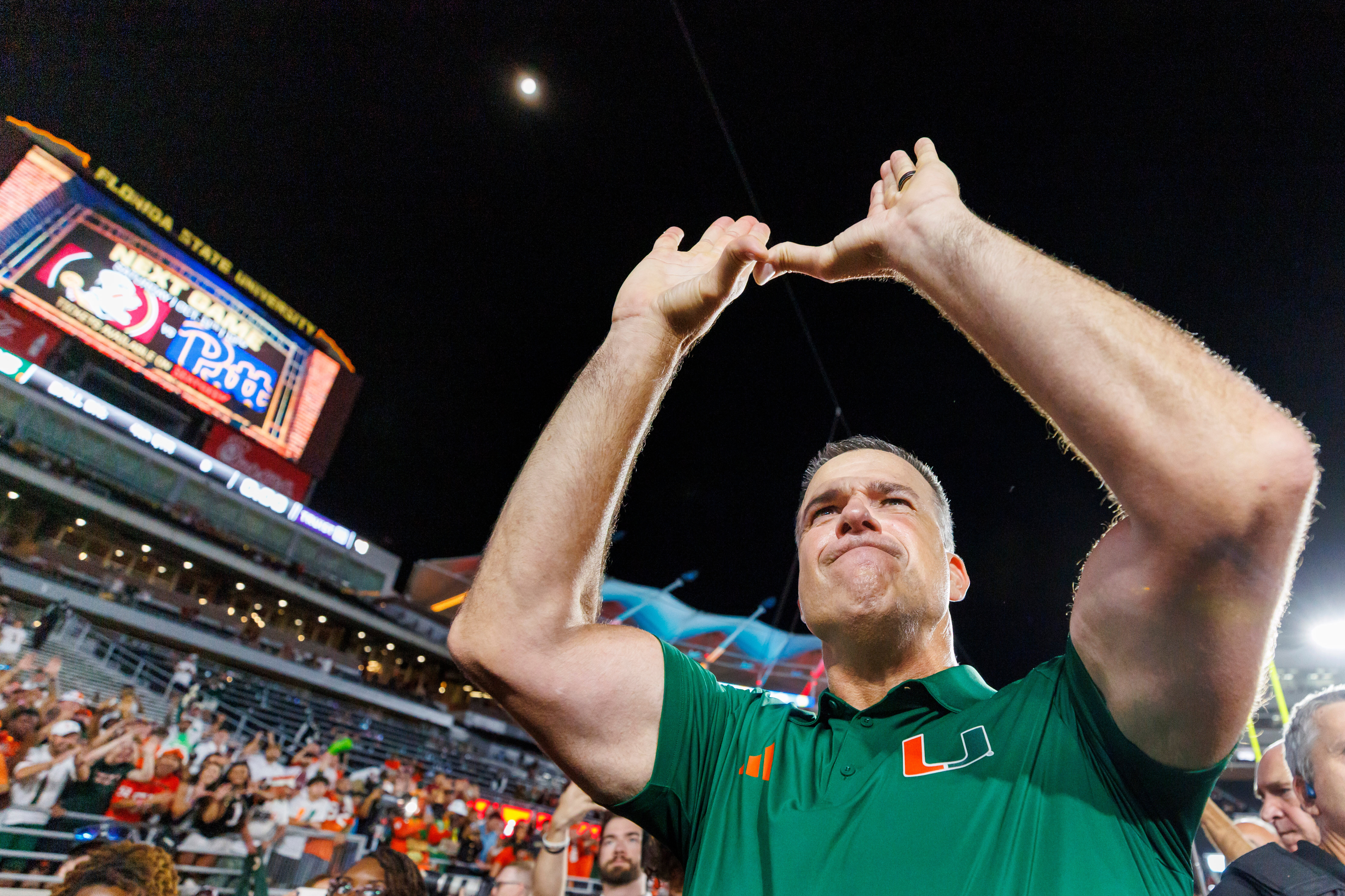 Miami head coach Mario Cristobal celebrates defeating Florida State in a NCAA college football game, Saturday, Oct. 4, 2025, in Tallahassee, Fla. 