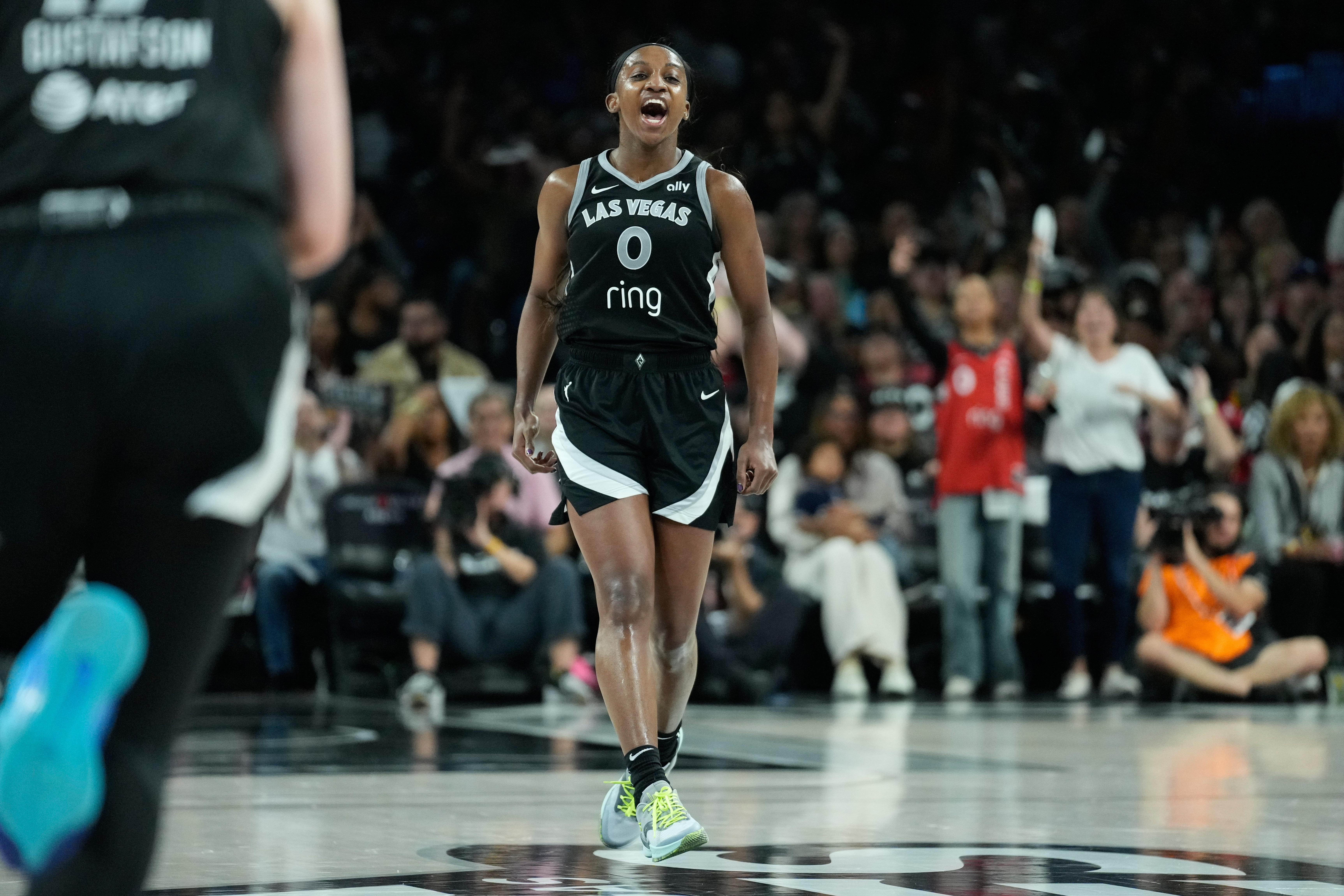 Las Vegas Aces guard Jackie Young (0) celebrates after making a 3-point shot during the second half in Game 2 of the WNBA basketball finals against the Phoenix Mercury, Sunday, Oct. 5, 2025, in Las Vegas. 