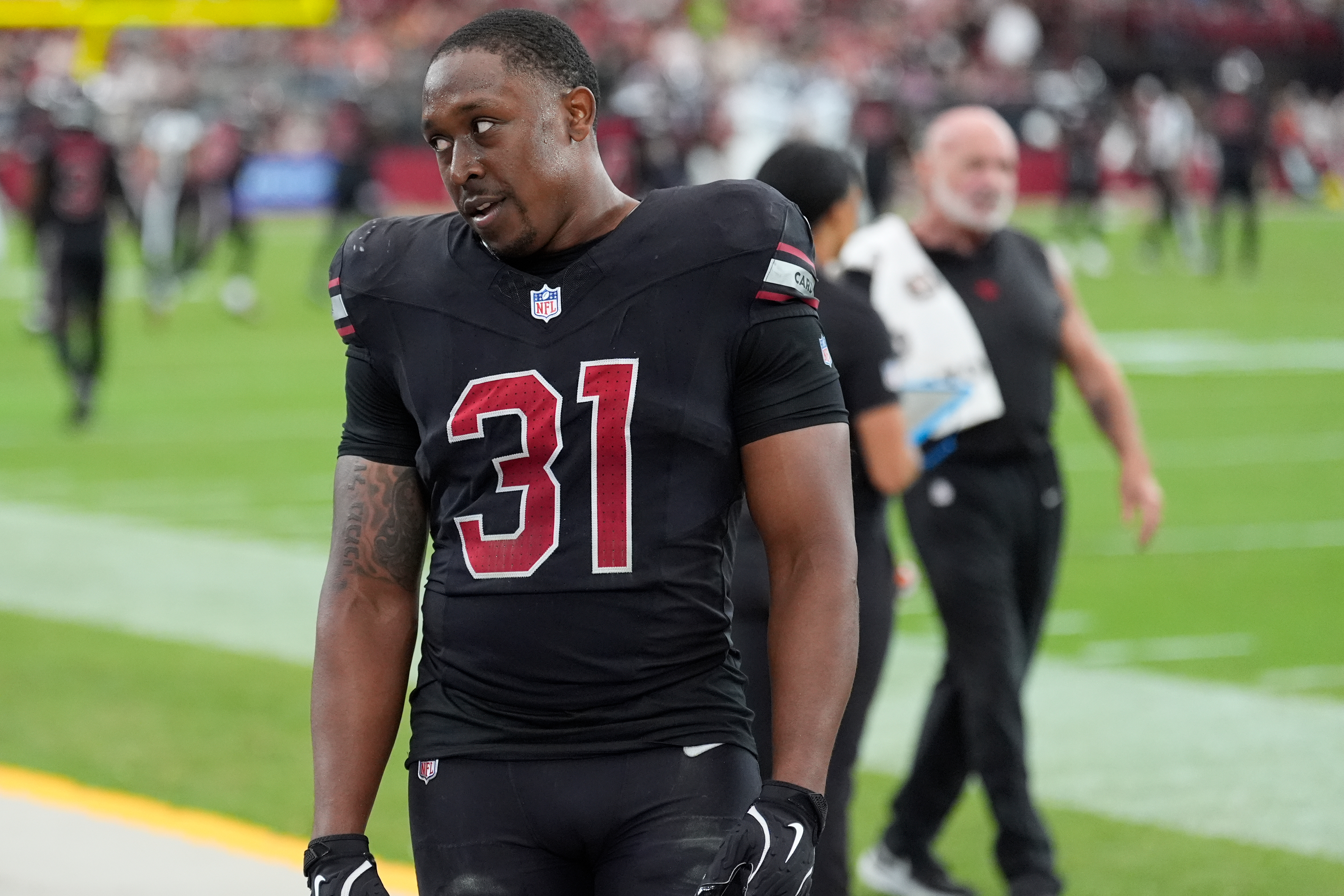 Arizona Cardinals running back Emari Demercado (31) reacts on the sideline after fumbling the ball out of the end zone on a touchdown run during the second half of an NFL football game against the Tennessee Titans, Sunday, Oct. 5, 2025, in Glendale, Ariz.
