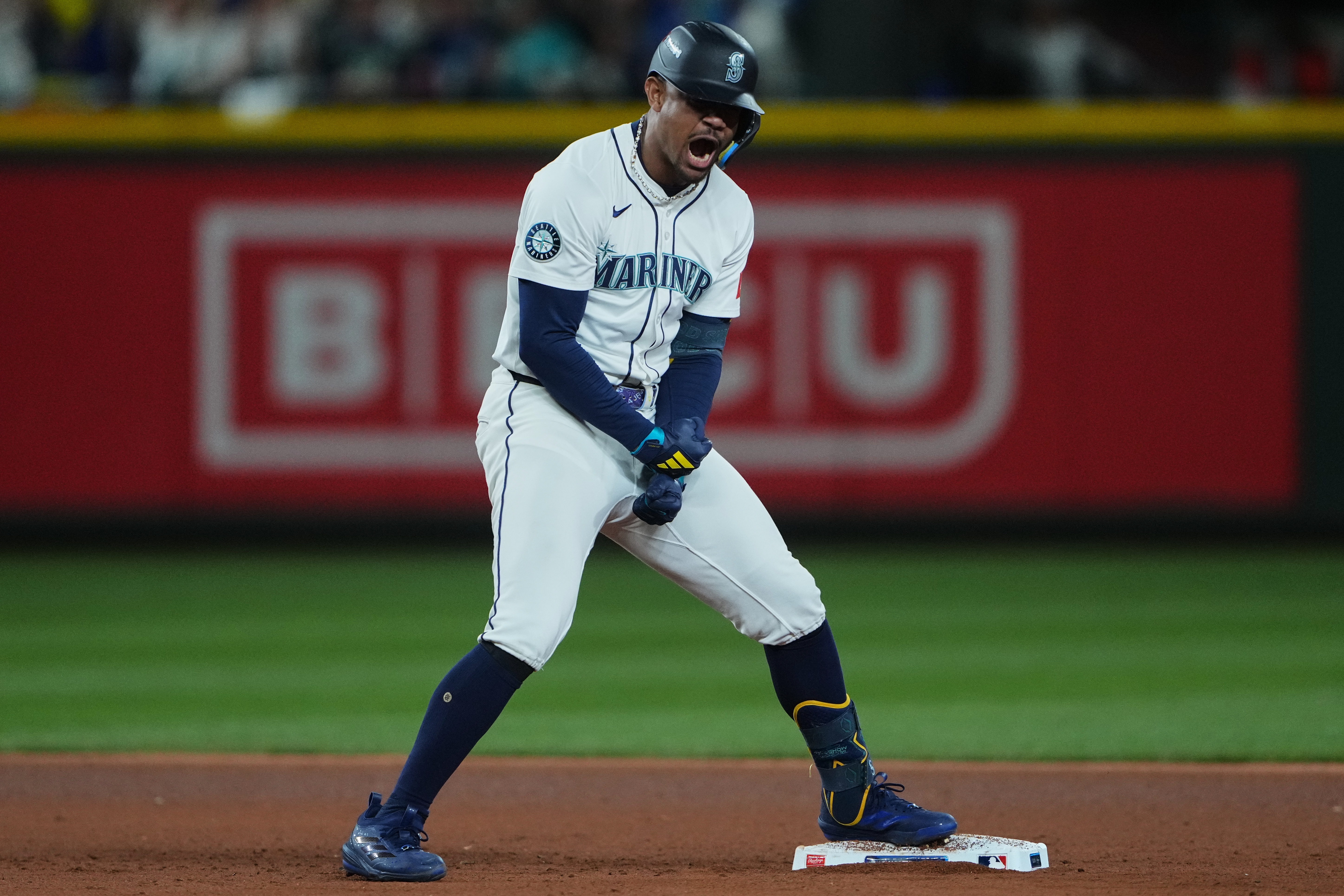 Seattle Mariners' Julio Rodriguez reacts after hitting a double to score Cal Raleigh for the go-ahead run during the eighth inning in Game 2 of baseball's American League Division Series against the Detroit Tigers, Sunday, Oct. 5, 2025, in Seattle.