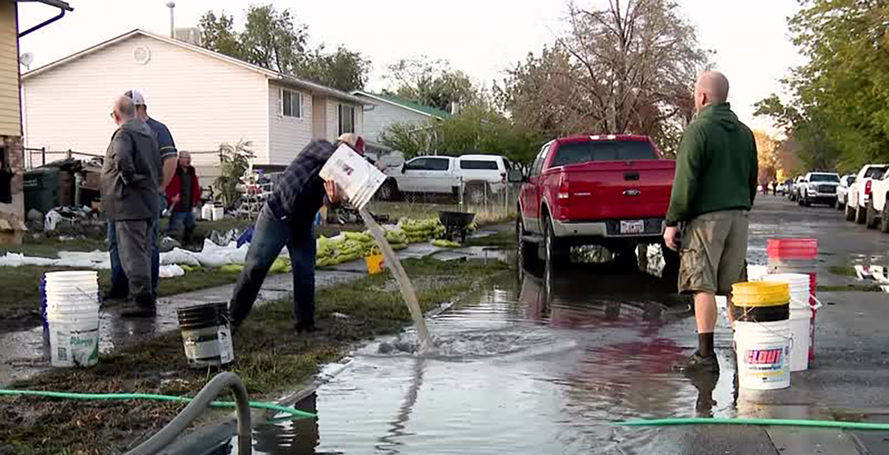 People clean up on Sunday, after Saturday’s historic rain caused significant flooding in a Rose Park neighborhood. Salt Lake City Mayor Erin Mendenhall declared a state of emergency over the flooding late Monday.