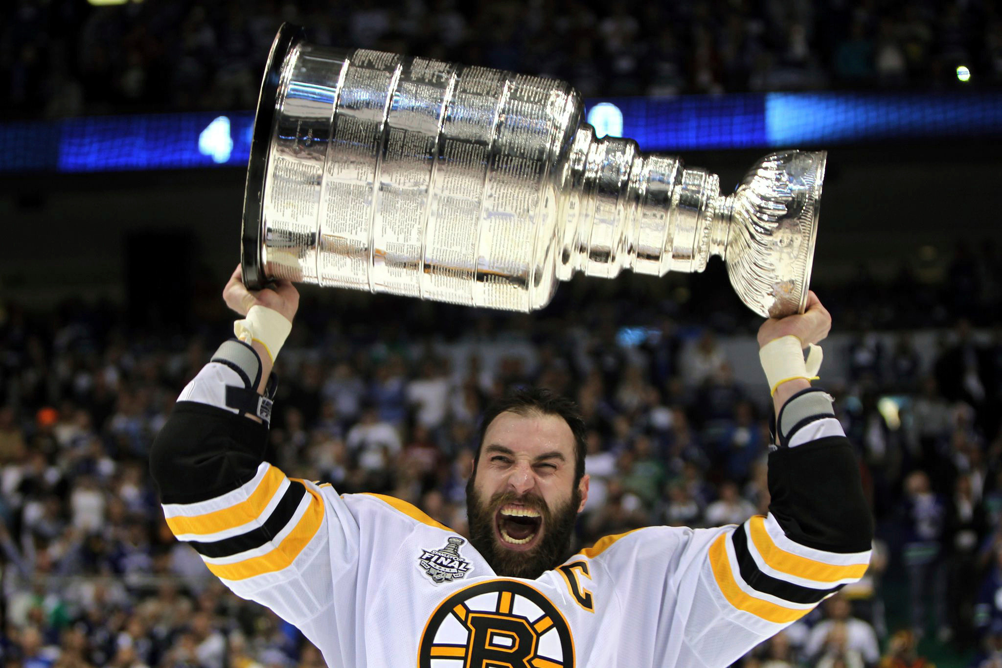 FILE - Boston Bruins' Zdeno Chara, of Slovakia, hoists the cup following the Bruins' 4-0 win over the Vancouver Canucks in Game 7 of the NHL hockey Stanley Cup Finals on June 15, 2011, in Vancouver, British Columbia, Canada.