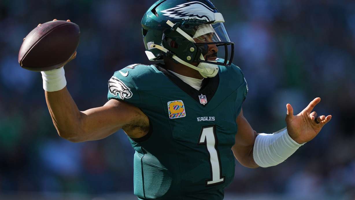Philadelphia Eagles quarterback Jalen Hurts looks to pass during the second half of an NFL football game against the Denver Broncos on Sunday, Oct. 5, 2025, in Philadelphia.