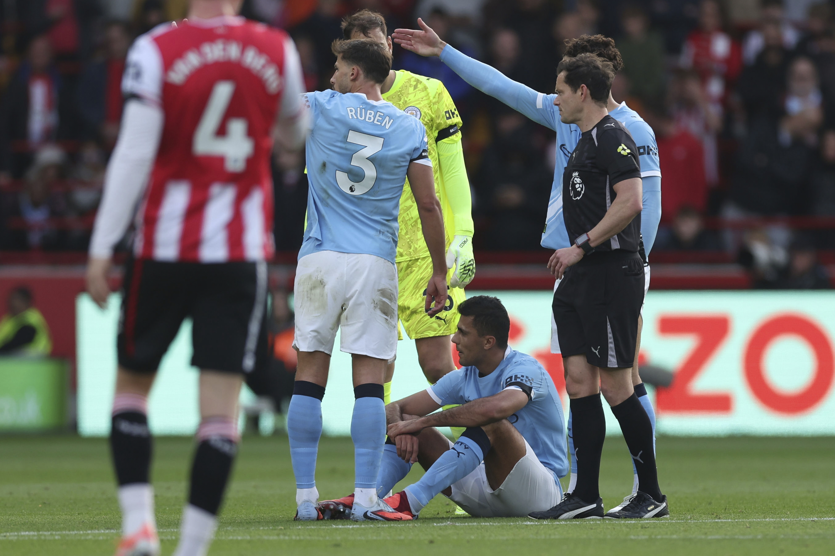 Manchester City's Rodri on the floor, before being taken off as injured, during the English Premier League soccer match between Brentford and Manchester City at the Gtech Community Stadium, Brentford, England, Sunday Oct. 5, 2025. 