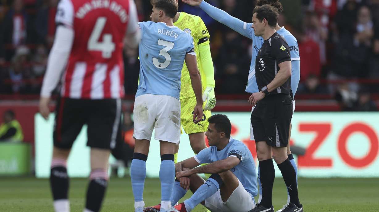 Manchester City's Rodri on the floor, before being taken off as injured, during the English Premier League soccer match between Brentford and Manchester City at the Gtech Community Stadium, Brentford, England, Sunday Oct. 5, 2025.