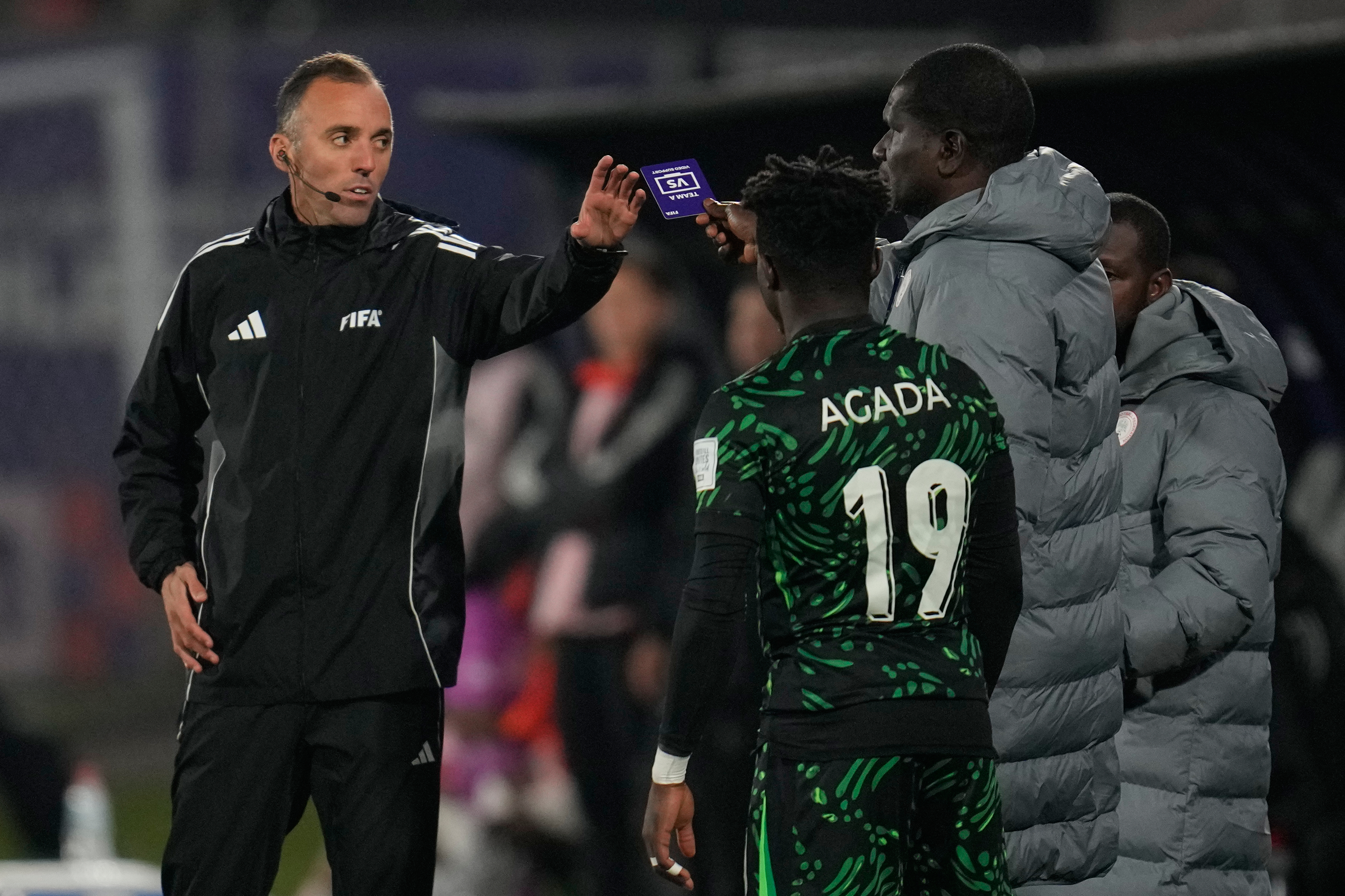 Nigeria's coach Aliyu Zubair asks for a VAR review to referee Joao Pinheiro, of Portugal, during a FIFA U-20 World Cup Group F soccer match against Colombia at Fiscal Stadium in Talca, Chile, Sunday, Oct. 5, 2025.