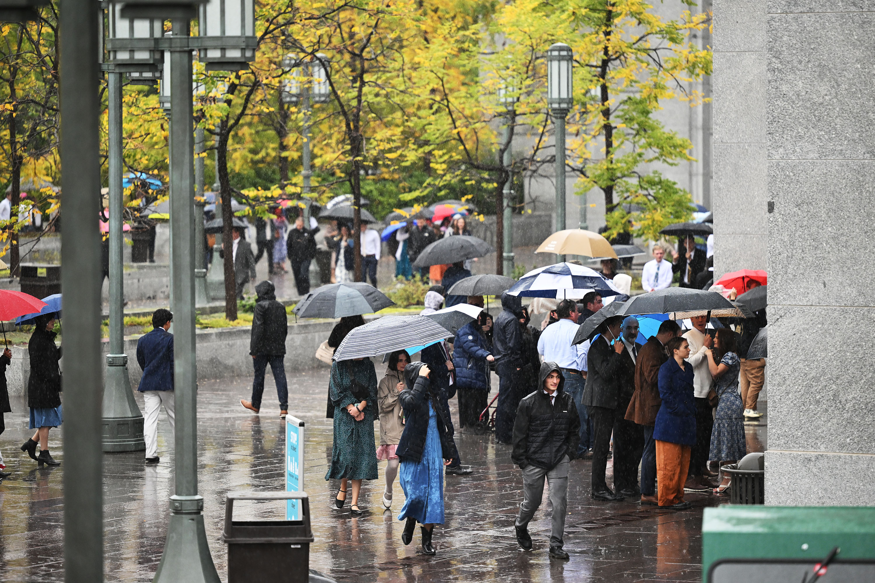 Conference attendees make their way to the Conference Center in Salt Lake City on Saturday. It was Salt Lake City's second-rainiest day since 1874.