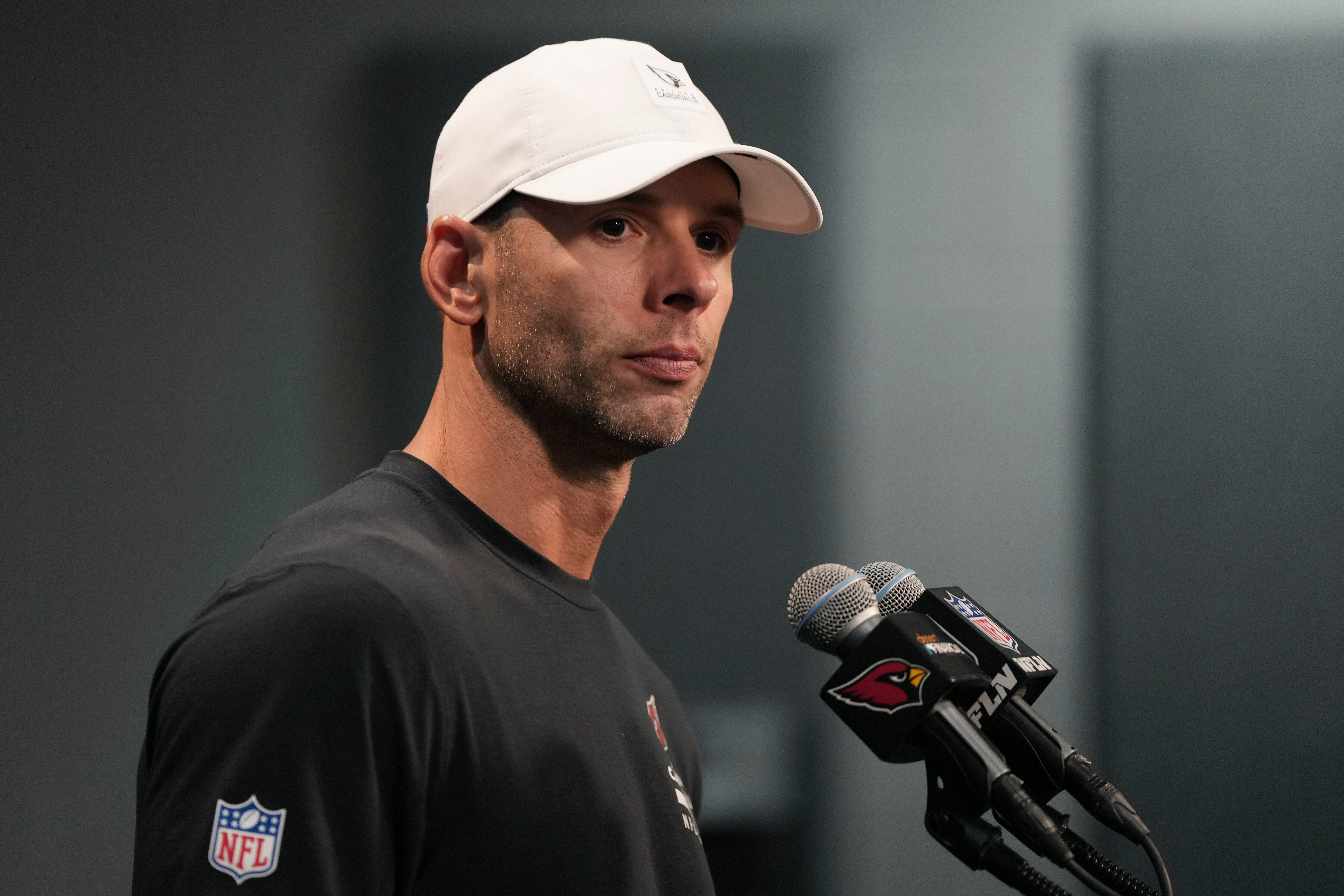 Arizona Cardinals head coach Jonathan Gannon pauses before answering a question during a news conference after an NFL football game against the Tennessee Titans Sunday, Oct. 5, 2025, in Glendale, Ariz.