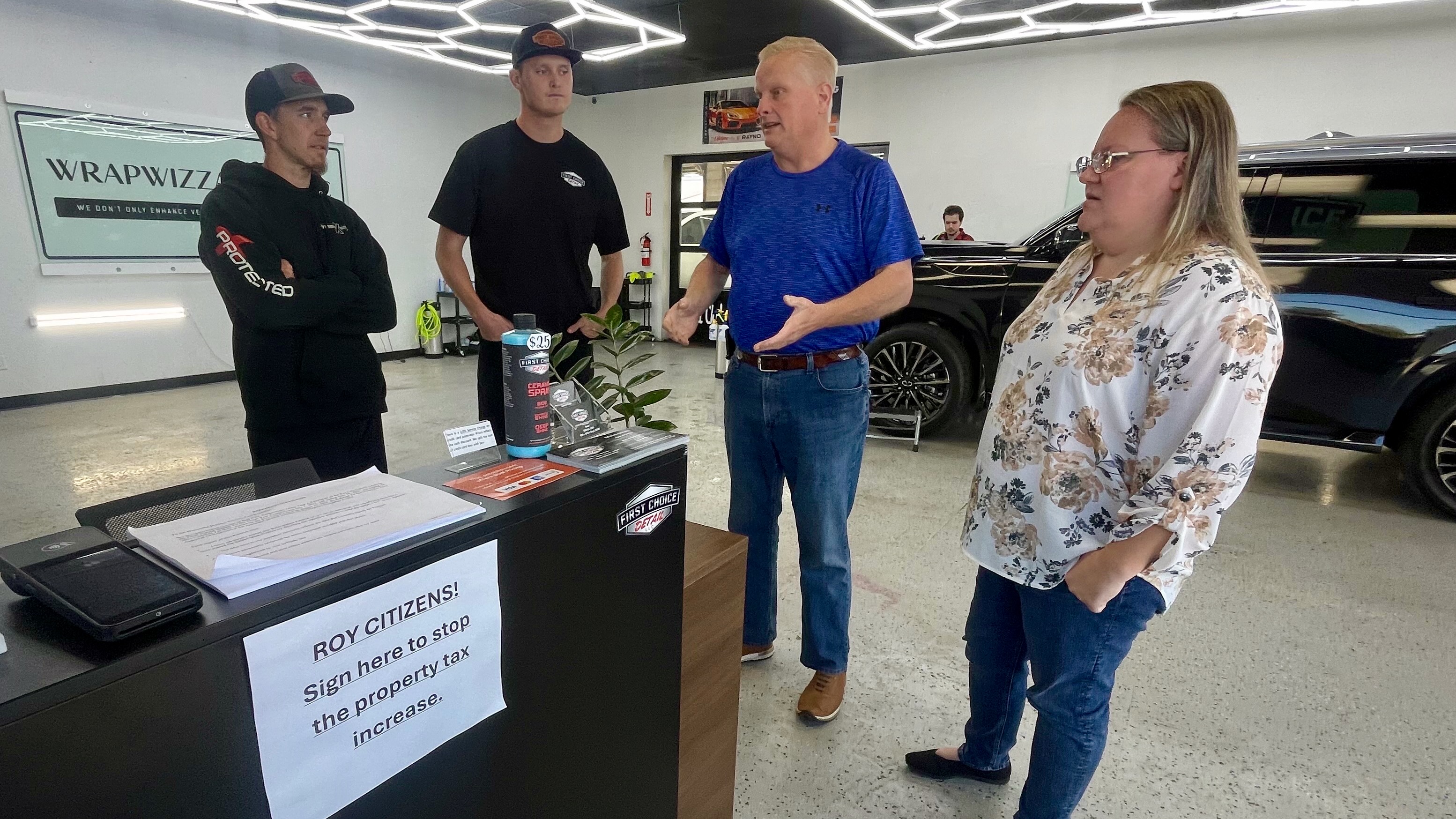 Cameron Hooper, Broc Evans, Ty Chaston and Deanne Chaston discuss a proposed property tax in Roy, which they oppose, on Monday. State officials last month denied the proposed increase and 34 others around Utah.