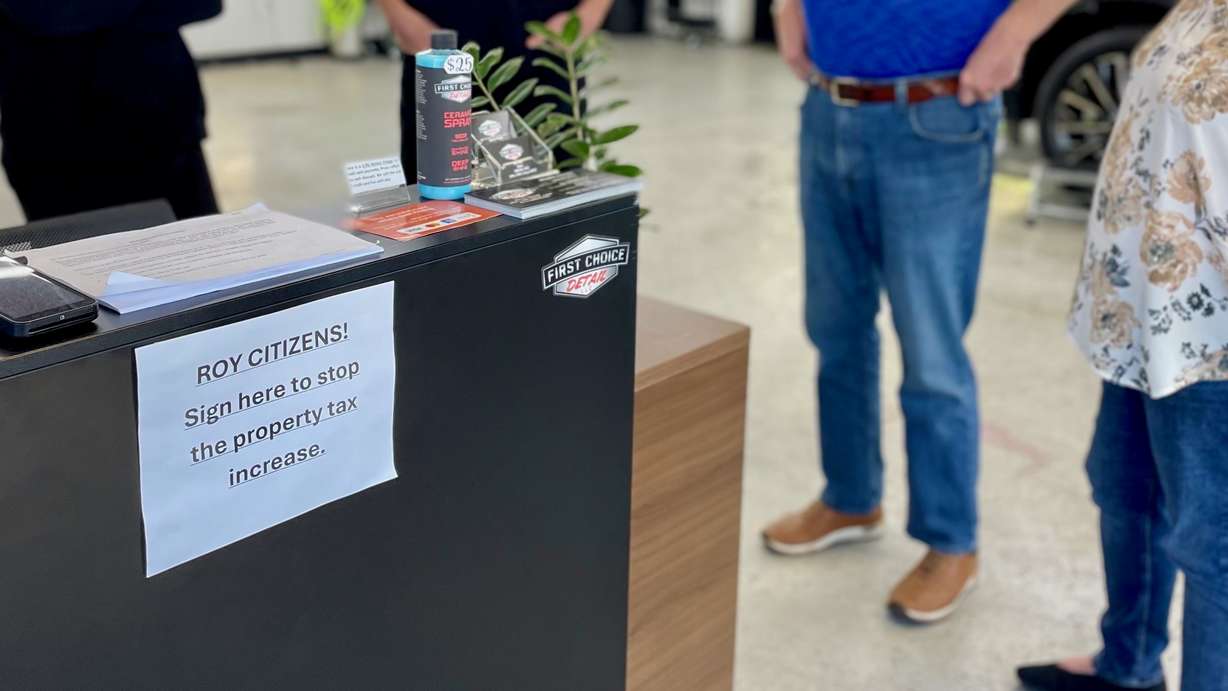 State officials in September denied proposed tax increases by Roy and 34 other taxing entities around Utah. The photo from Monday shows a sign in a Roy auto detailing shop where signatures were gathered in a bid to stall the increase.