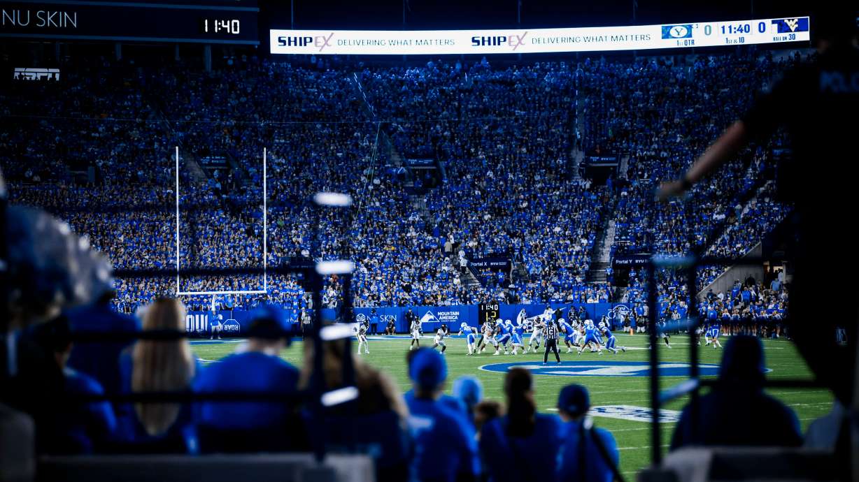 BYU fans cheer as the No. 23 Cougars play a Big 12 football game against West Virginia, Friday, Oct. 3, 2025 at LaVell Edwards Stadium in Provo, Utah.