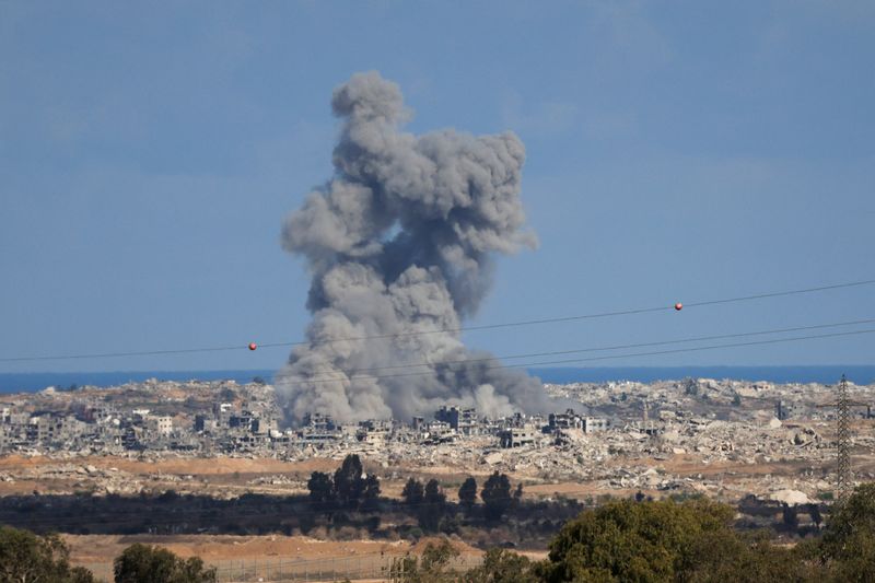 Smoke rises from explosions in Gaza, as seen from southern Israel, Tuesday. 