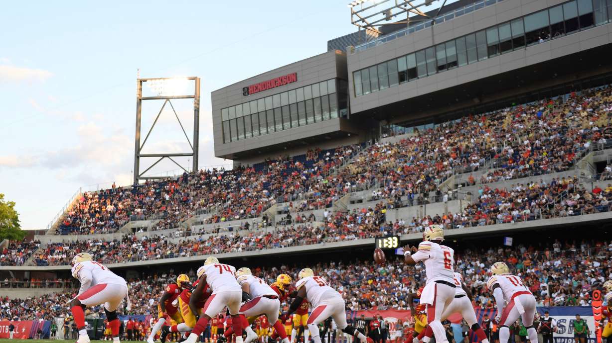 FILE - Birmingham Stallions quarterback J'Mar Smith, front right, collects the snap during the first half of a USFL football game against the Philadelphia Stars for the league championship, Sunday, July. 3, 2022, in Canton, Ohio.