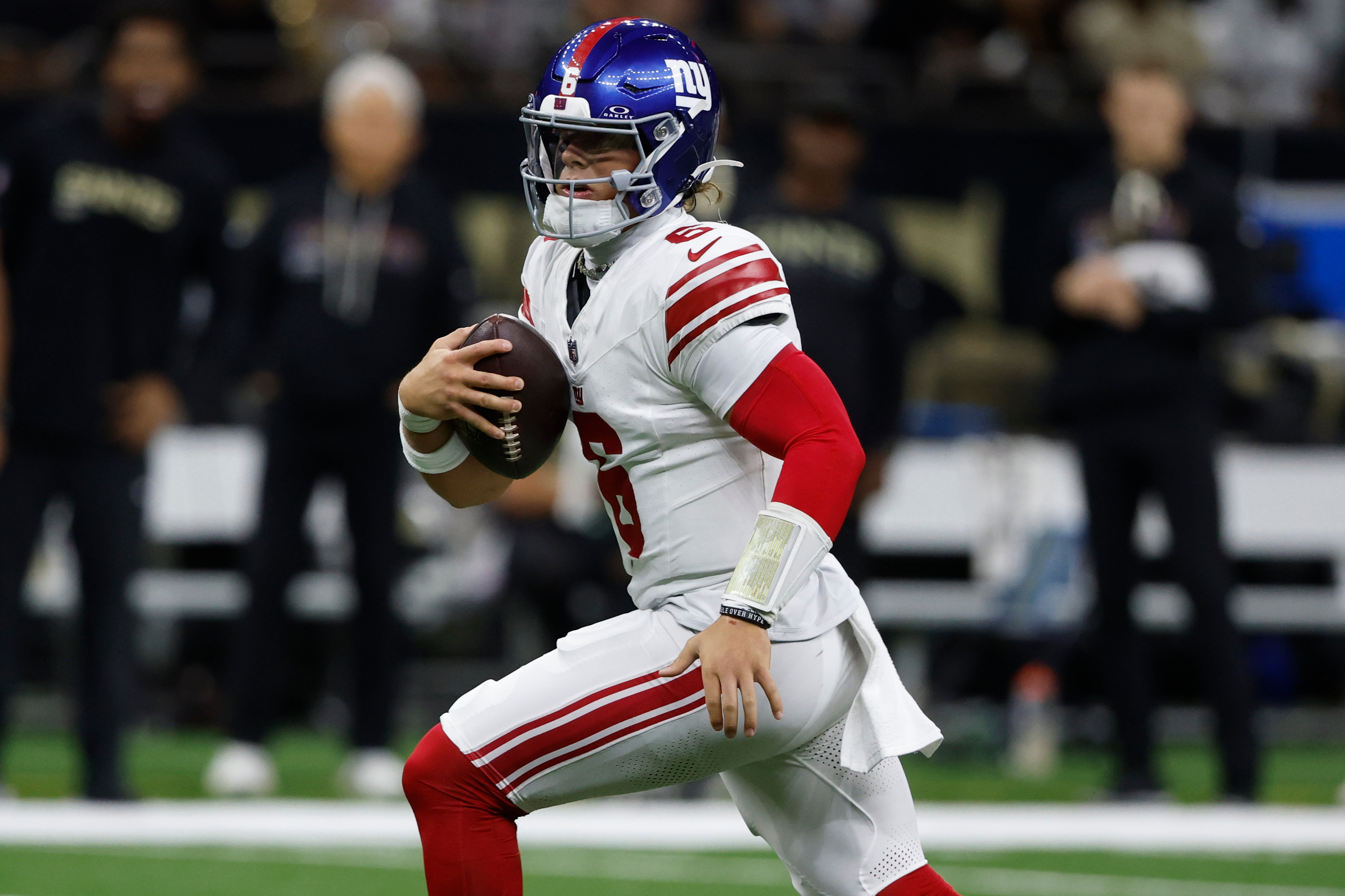 New York Giants quarterback Jaxson Dart (6) runs out of the pocket against the New Orleans Saints in the first half of an NFL football game, Sunday, Oct. 5, 2025, in New Orleans.