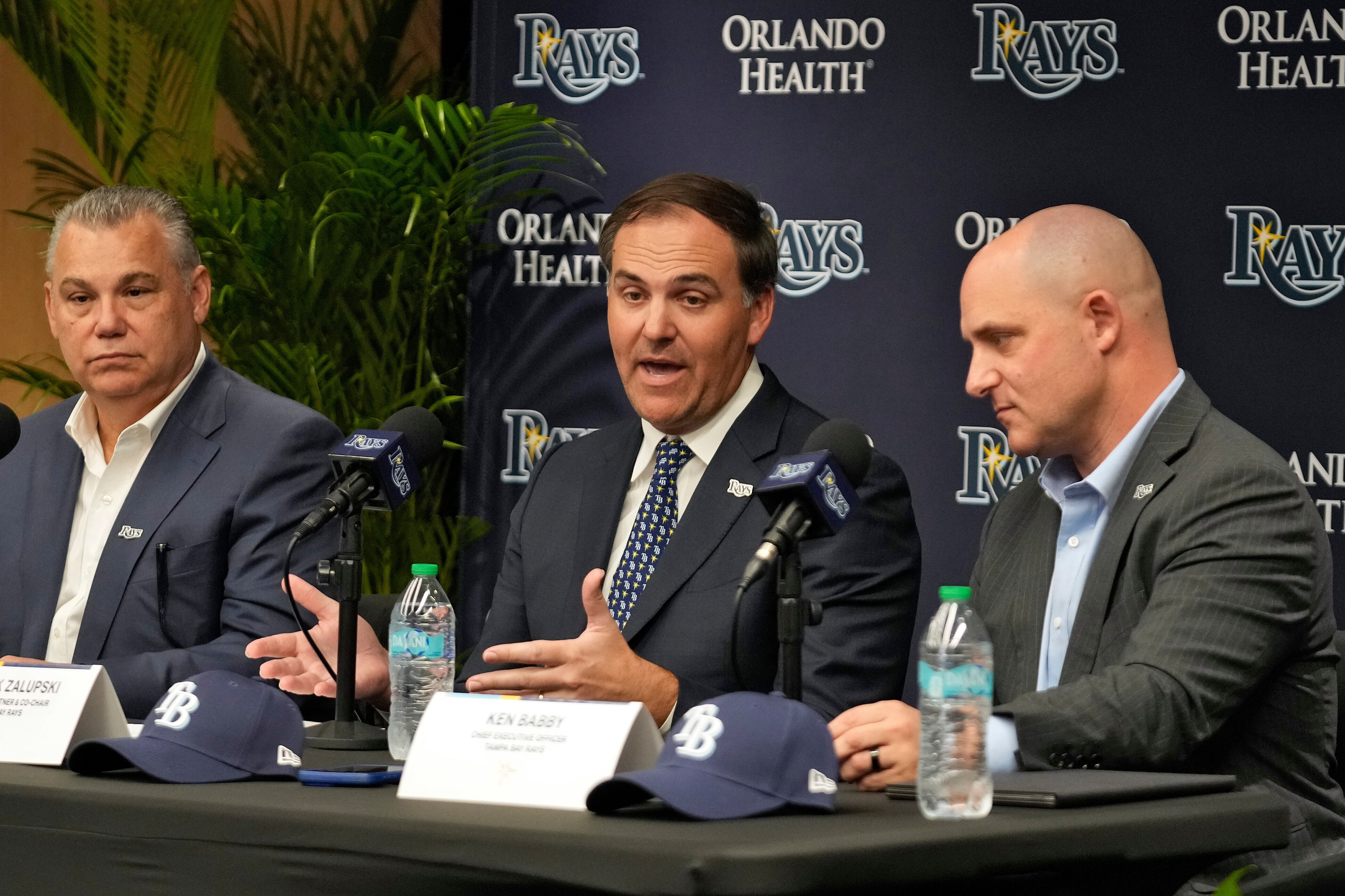 New Tampa Bay Rays ownership managing partner and co-chair Patrick Zalupski, center, answers a question, as co-chair Bill Cosgrove, left, and chief executive officer Ken Babby, right, look on during an introductory baseball news conference, Tuesday, Oct. 7, 2025, in Tampa, Fla. 