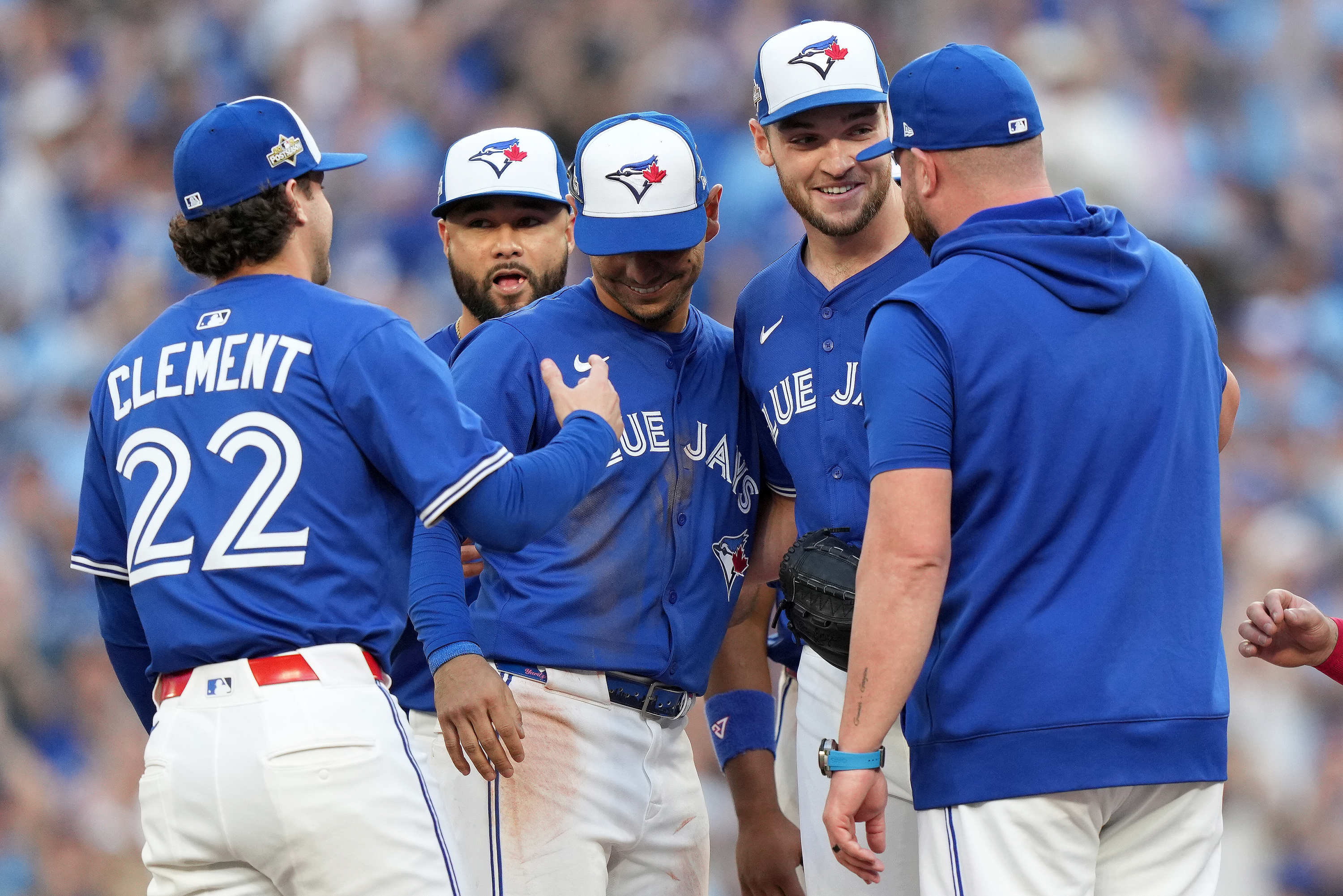 Toronto Blue Jays pitcher Trey Yesavage, second from right, celebrates with teammates after being pulled from the mound by manager John Schneider, right, during the sixth inning of Game 2 of baseball's American League Division Series against the New York Yankees in Toronto, Sunday, Oct. 5, 2025.