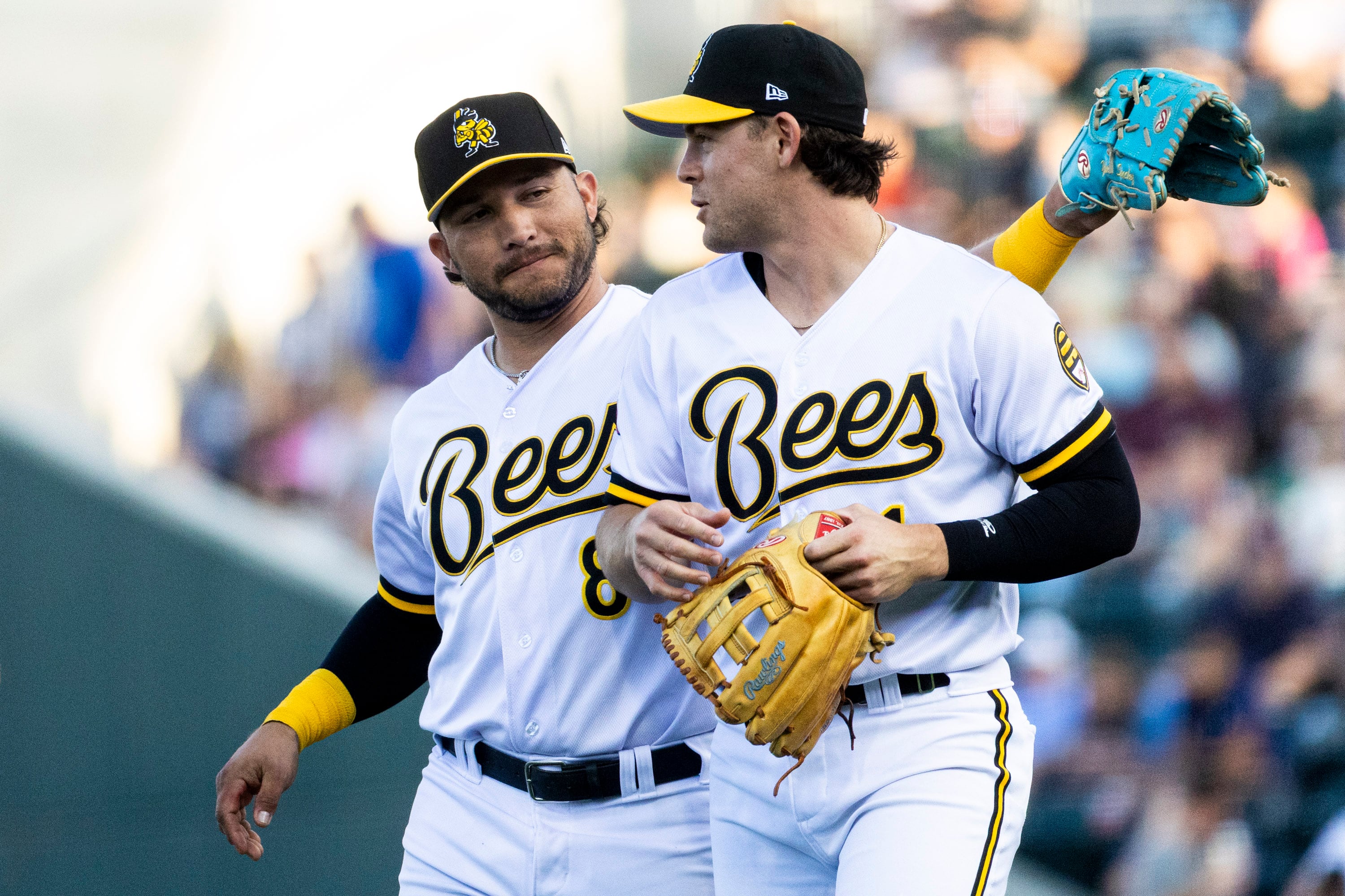 Salt Lake Bees infielder Yolmer Sánchez, left, and Scott Kingery take the field between innings during a minor league baseball game against the Albuquerque Isotopes held at The Ballpark at America First Square in South Jordan on July 22.