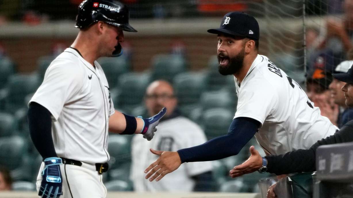 Detroit Tigers' Spencer Torkelson, left, is congratulated by teammate Riley Greene after scoring during the ninth inning in Game 3 of baseball's American League Division Series against the Seattle Mariners Tuesday, Oct. 7, 2025, in Detroit.