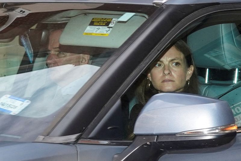 Patrick Fitzgerald and Jessica Carmichael, the lawyers of former FBI Director James Comey, depart U.S. District Court in Alexandria, Va., Wednesday. Fitzgerald said he plans to file multiple challenges to the charges against Comey.