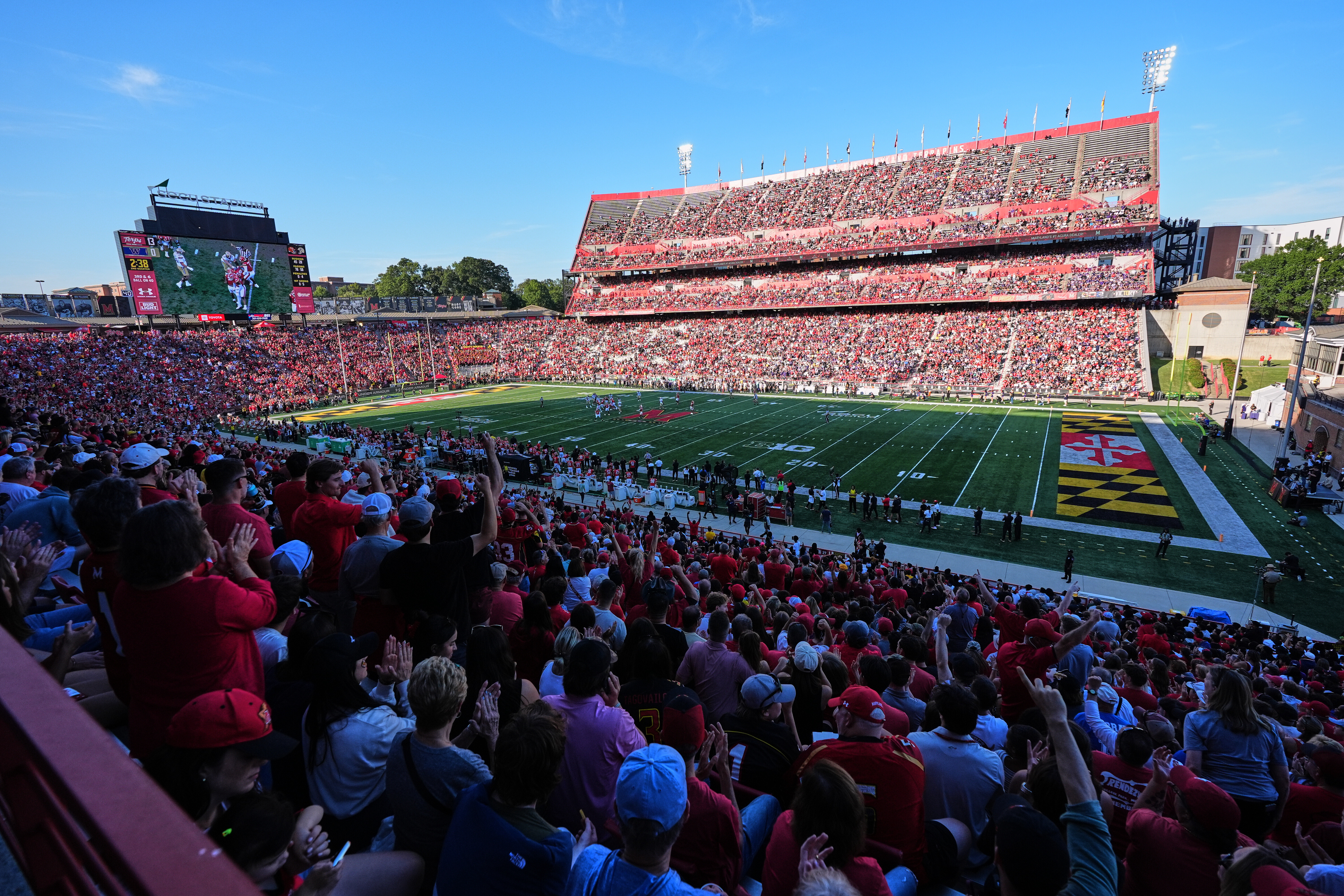 Fans cheer during the first half of an NCAA college football game between Maryland and Washington, Saturday, Oct. 4, 2025, in College Park, Md. 