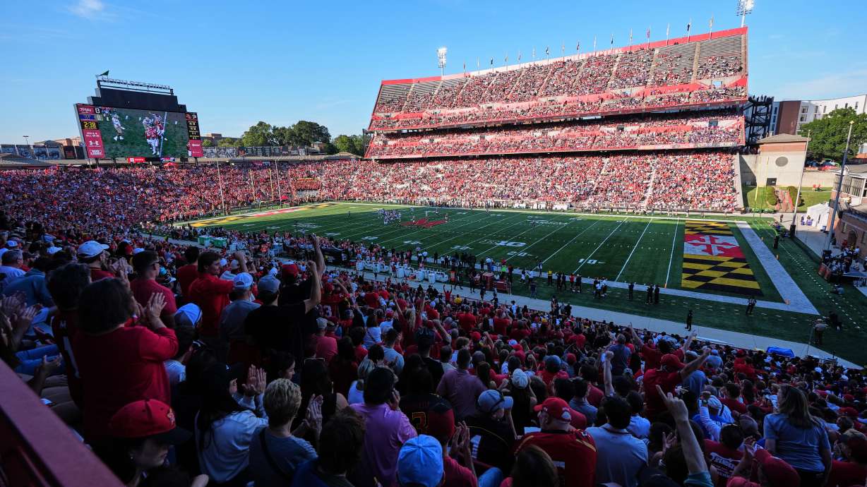 Fans cheer during the first half of an NCAA college football game between Maryland and Washington, Saturday, Oct. 4, 2025, in College Park, Md.