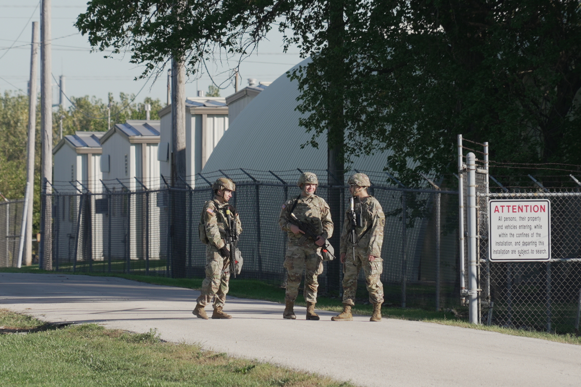 Military personnel in uniform, with the Texas National Guard patch on, are seen at the U.S. Army Reserve Center, Wednesday, Oct. 8, 2025, in Elwood, Ill., a suburb of Chicago.