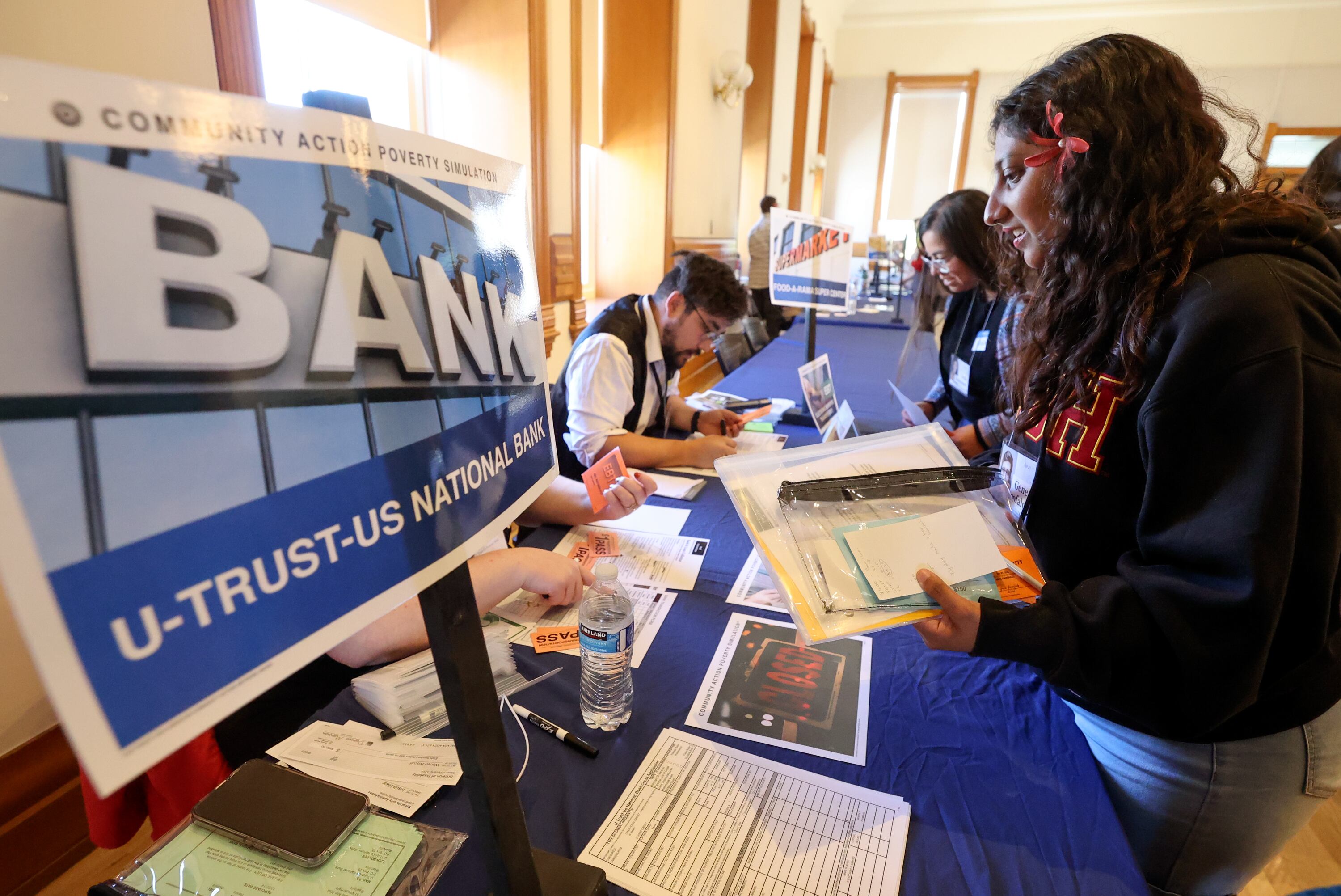 Lani Prasad, Family Haven social work intern, participates in a poverty simulation at the kNOw Poverty Summit at Provo City Library at Academy Square in Provo on Wednesday.