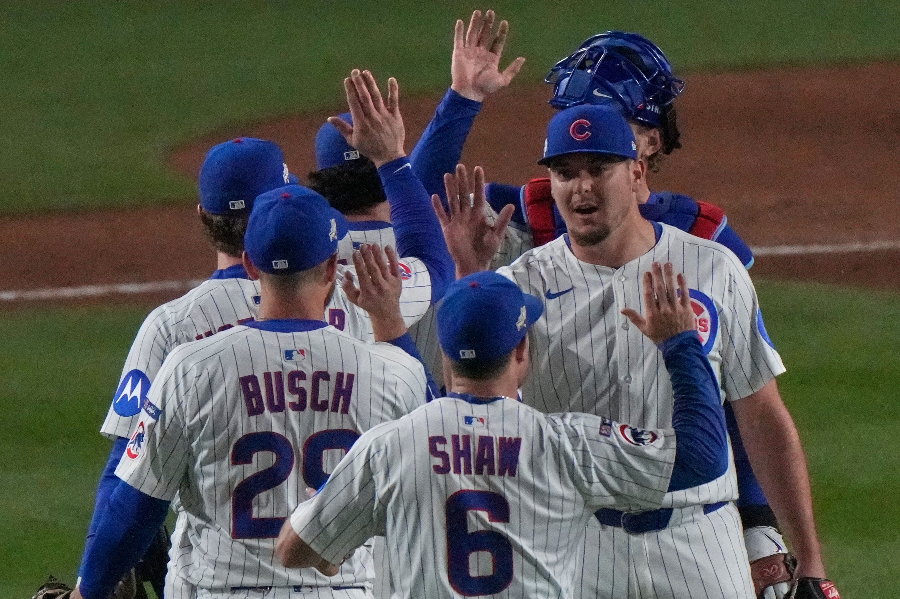 Chicago Cubs players celebrate after Game 3 of baseball's National League Division Series against the Milwaukee Brewers Wednesday, Oct. 8, 2025, in Chicago. 