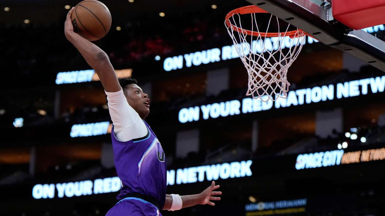 Utah Jazz forward Ace Bailey dunks during the second half of an NBA basketball preseason game against the Houston Rockets in Houston, Wednesday, Oct. 8, 2025.