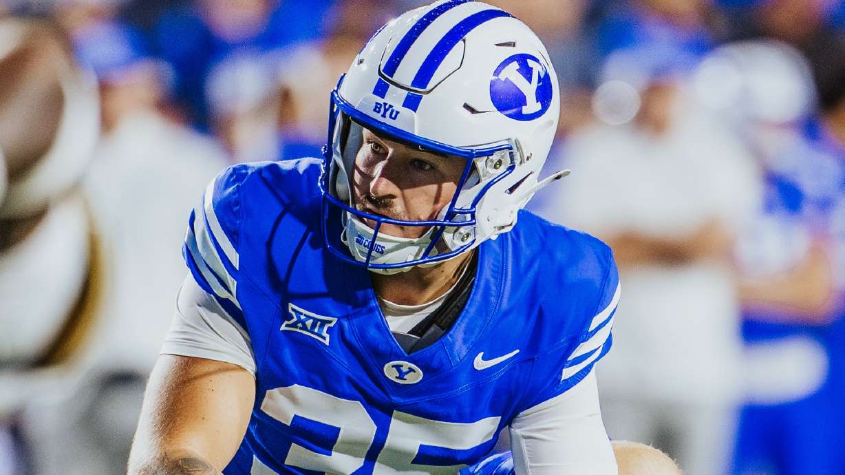 BYU punter Sam Vander Haar gets ready to hold a field-goal attempt during a Big 12 football game, Friday, Oct. 3, 2025 against West Virginia at LaVell Edwards Stadium in Provo, Utah.
