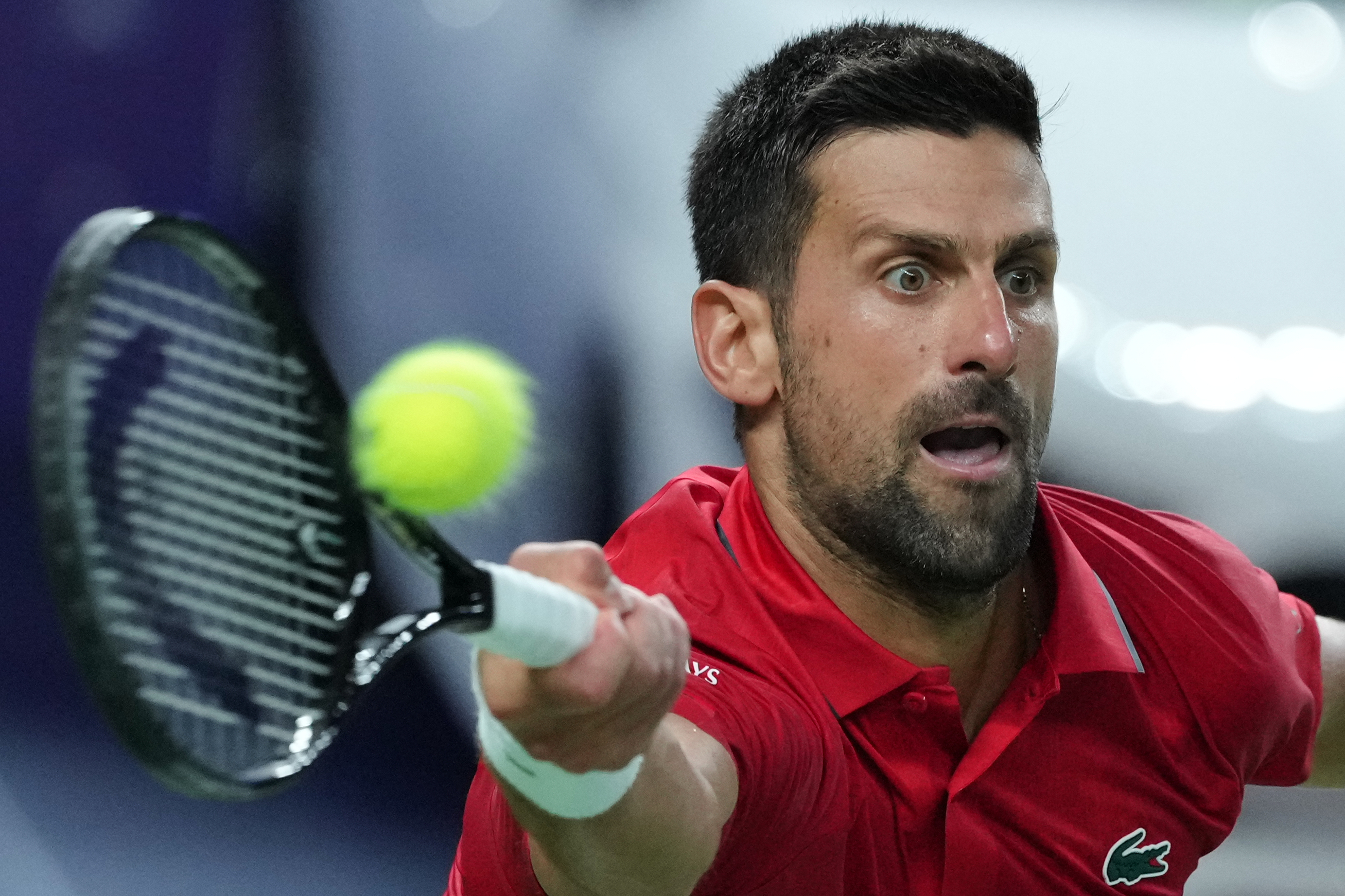 Novak Djokovic of Serbia returns a backhand shot from Zizou Bergs of Belgium during the men's singles quarterfinal match of the Shanghai Masters tennis tournament at Qizhong Forest Sports City Tennis Center, in Shanghai, China, Thursday, Oct. 9, 2025.