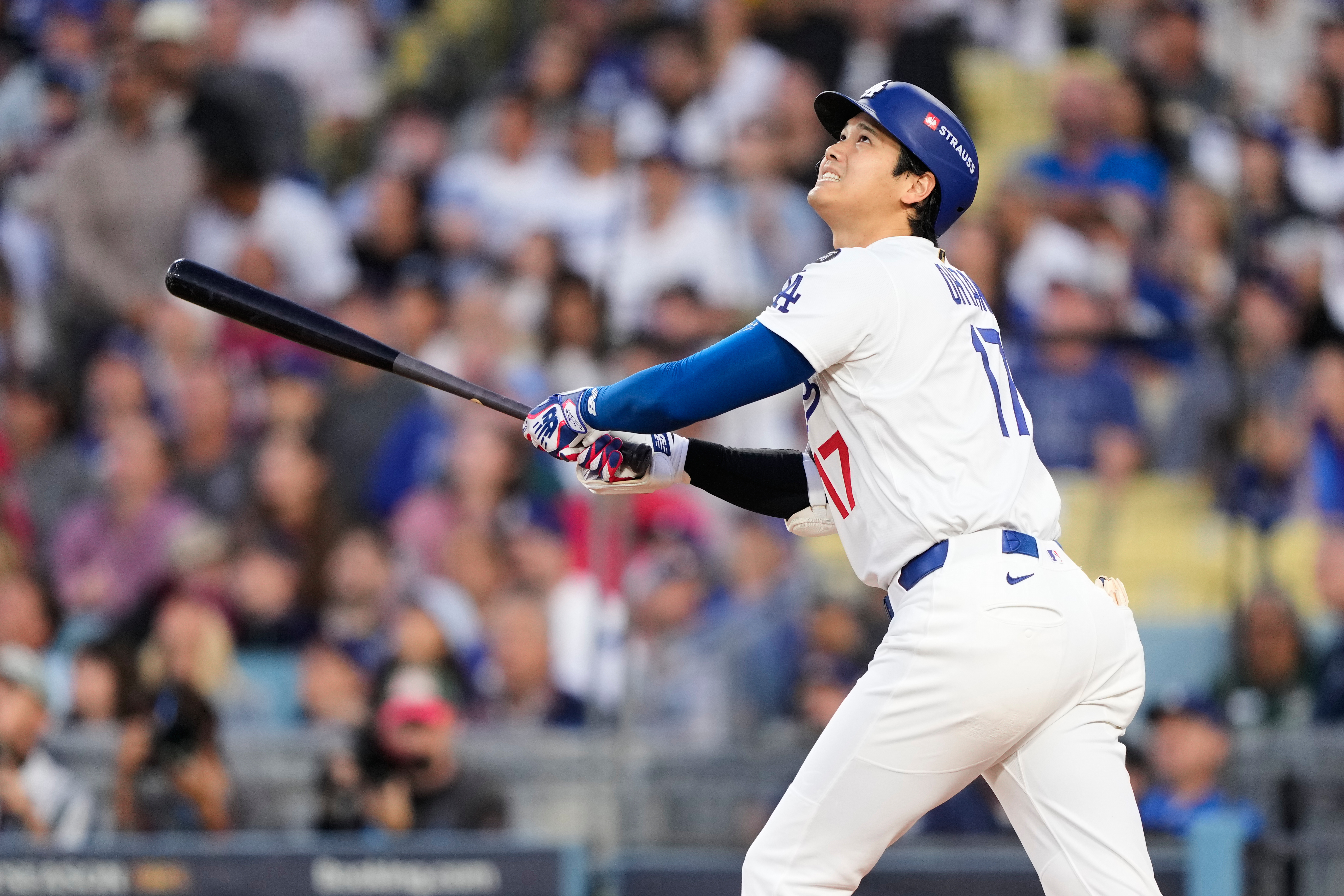 Los Angeles Dodgers' Shohei Ohtani flies out during the first inning of Game 3 of baseball's National League Division Series against the Philadelphia Phillies, Wednesday, Oct. 8, 2025, in Los Angeles. 
