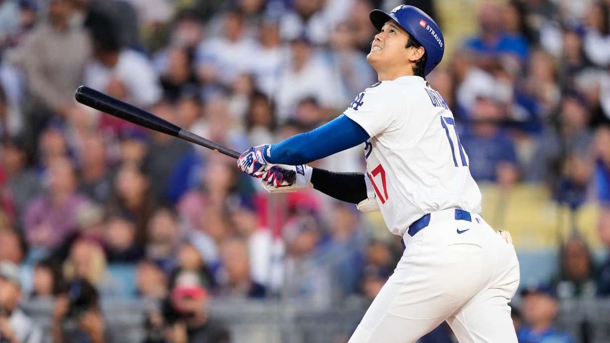Los Angeles Dodgers' Shohei Ohtani flies out during the first inning of Game 3 of baseball's National League Division Series against the Philadelphia Phillies, Wednesday, Oct. 8, 2025, in Los Angeles.