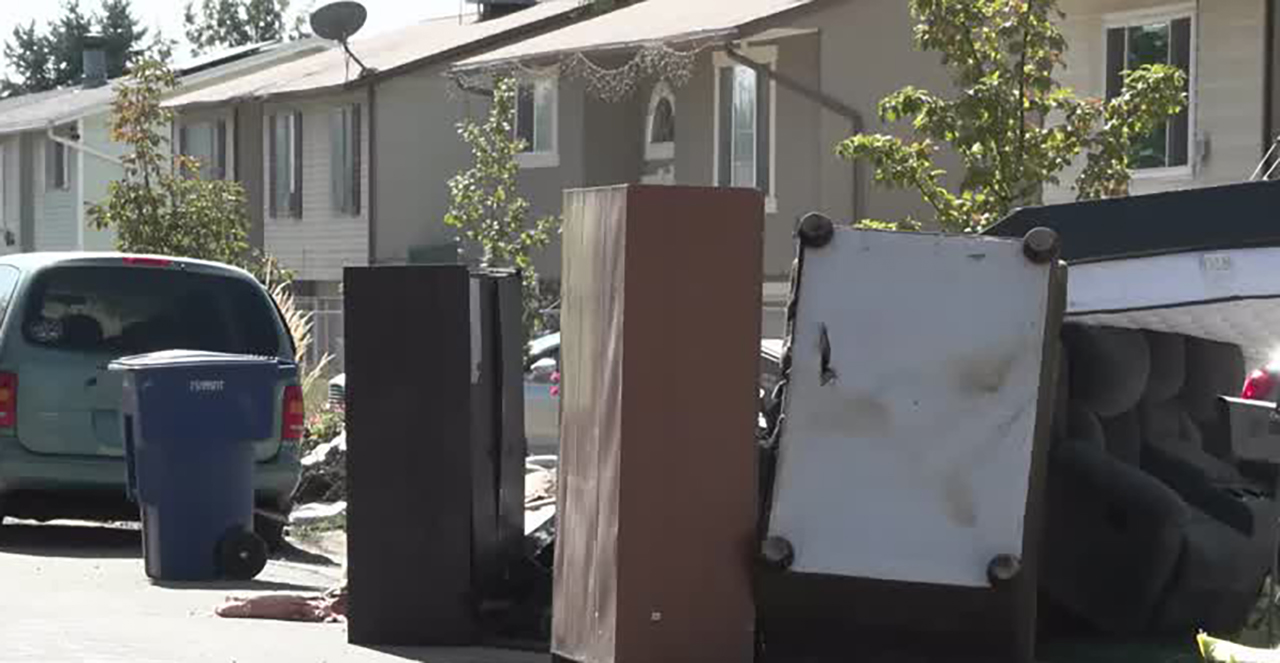 Damaged belongings are seen outside a home in Westpointe neighborhood of Salt Lake City on Wednesday after a weekend flood.