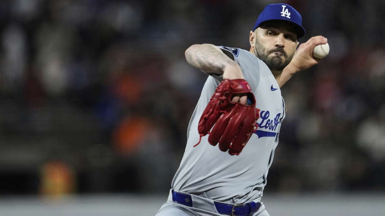 Los Angeles Dodgers pitcher Tanner Scott throws to a San Francisco Giants batter during the ninth inning of a baseball game Saturday, Sept. 13, 2025, in San Francisco.